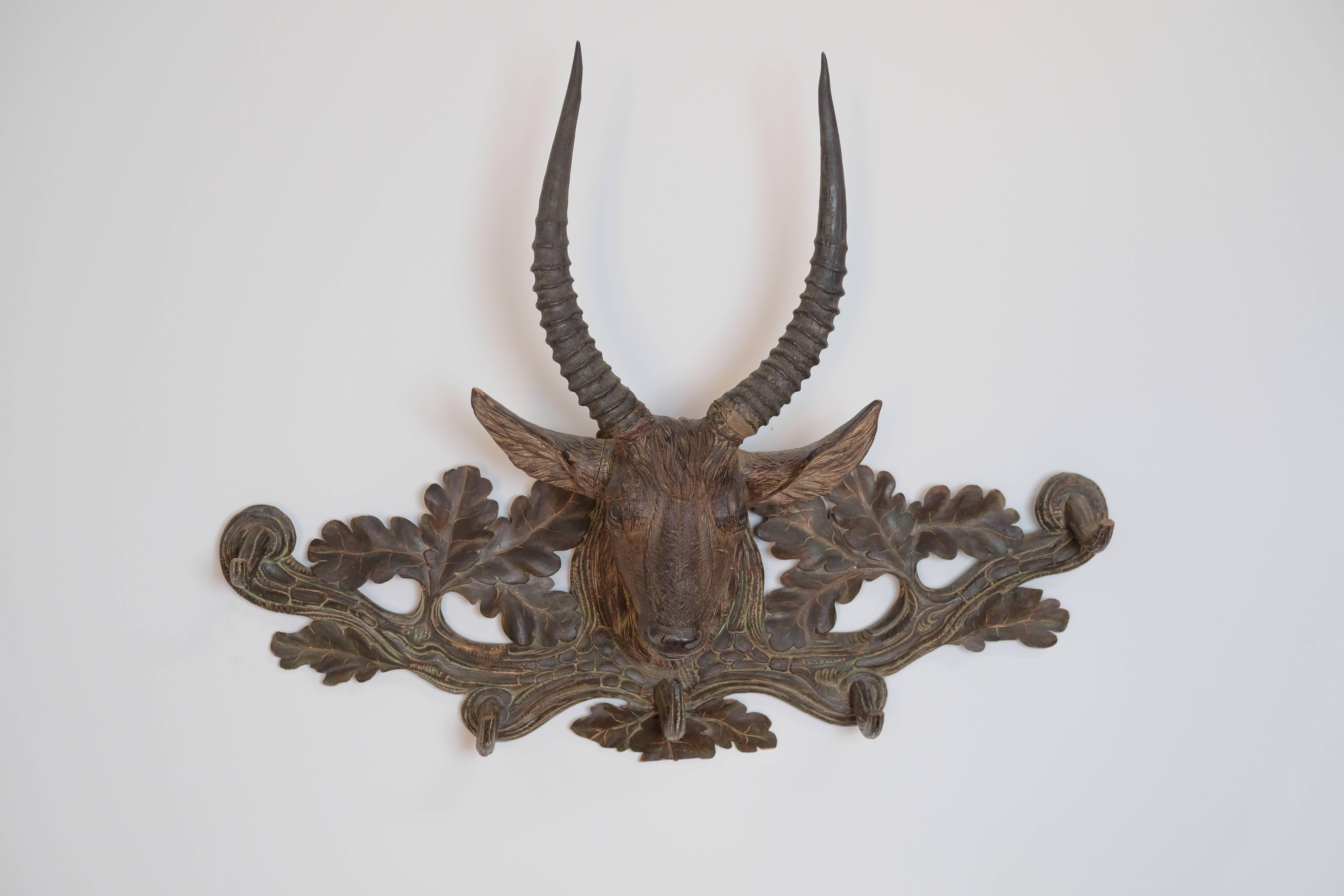 Carved lindenwood Ibex coat rack. Black Forest time period, late 1880s, Switzerland.