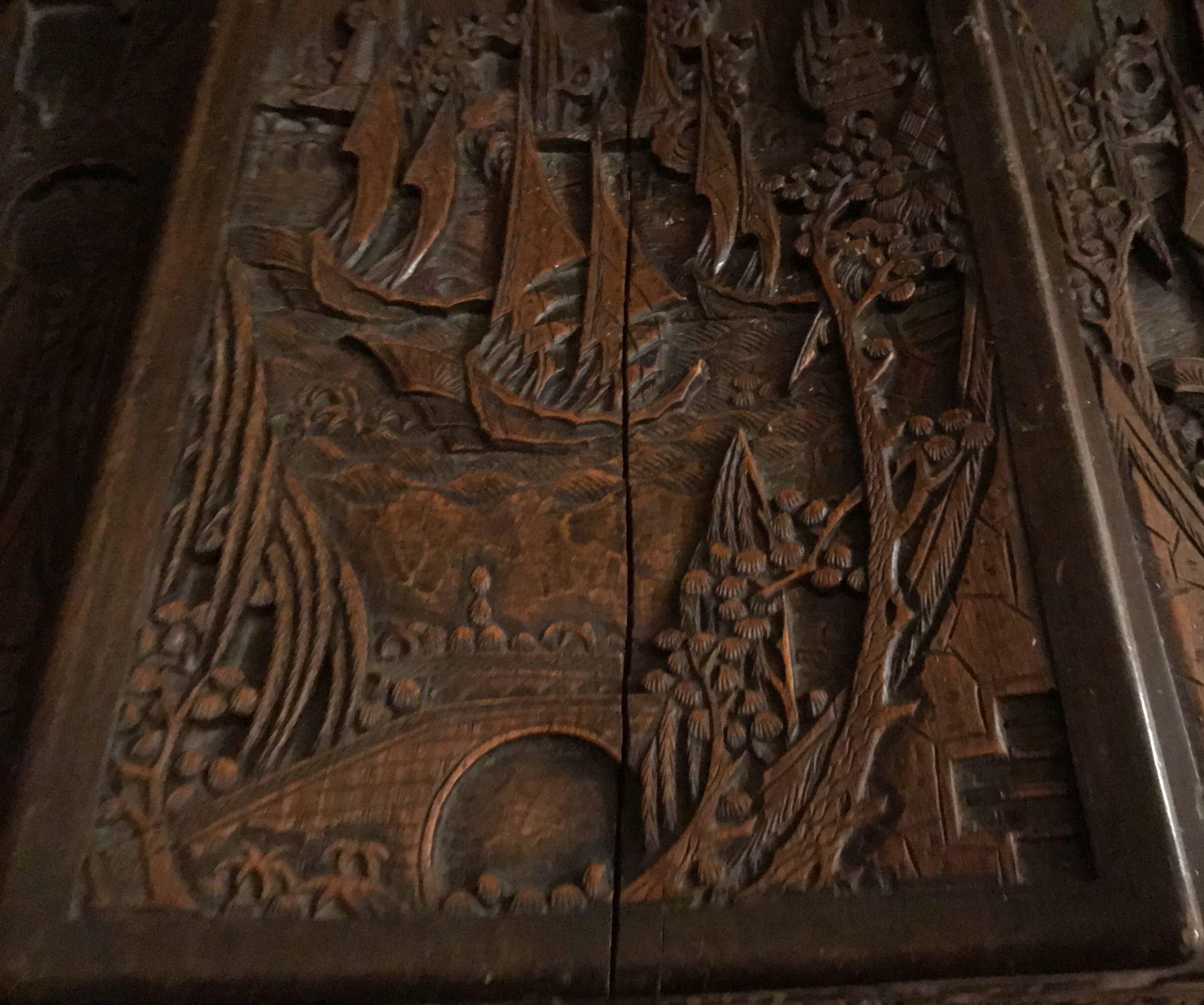 Mid-20th century
Profusely carved camphor wood with a rich deep patina, depicting typical oriental harbour villages and shipping scenes, the top of the chests lid has a shrinkage crack.