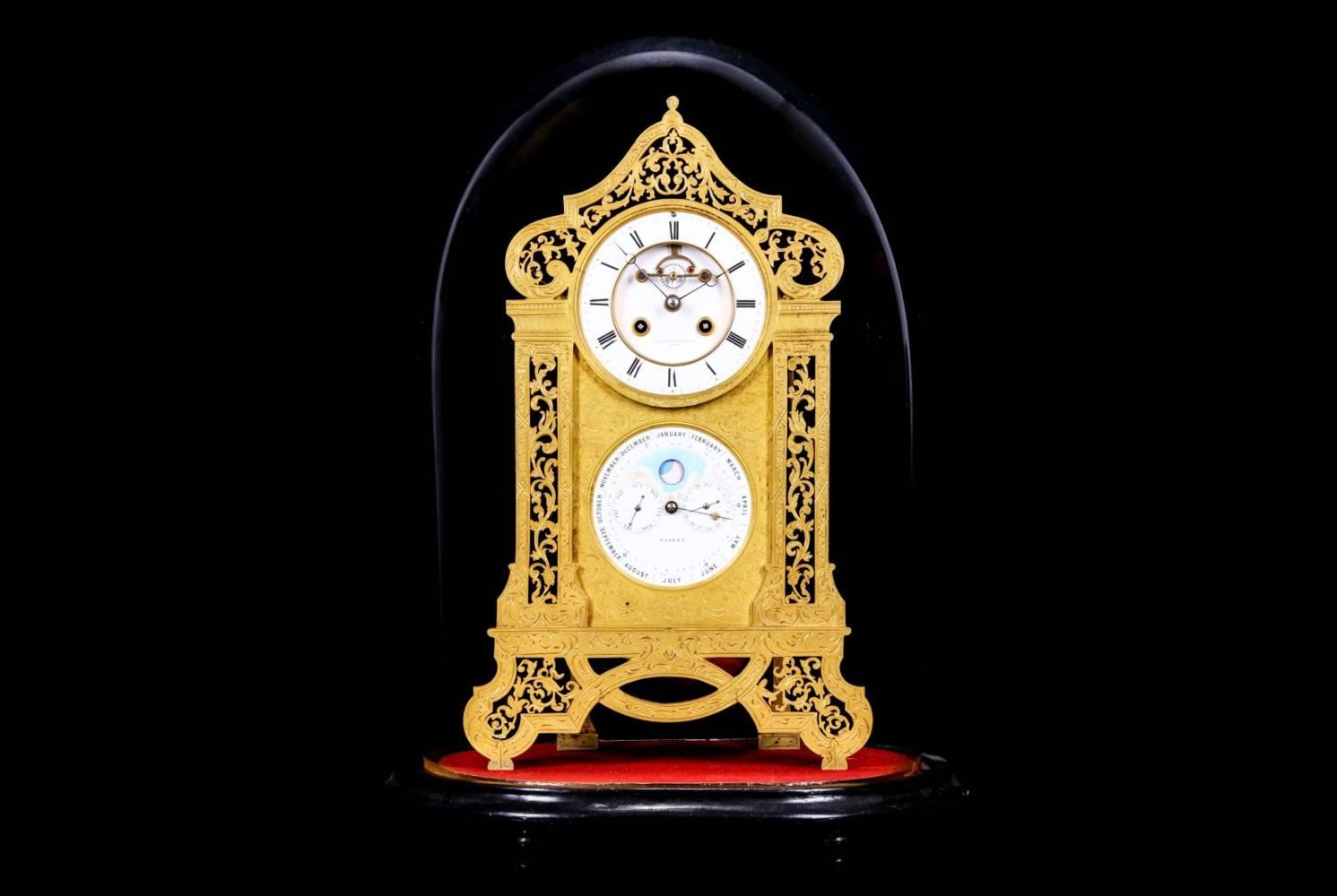 A fine mid-19th century French gilt bronze mantel clock with perpetual calendar, equation of time and Moonphase by Brocot & Delettrez, Paris.
The engraved and pierced case modelled as a pair of columns surmounted by a scrolling dome, raised on an