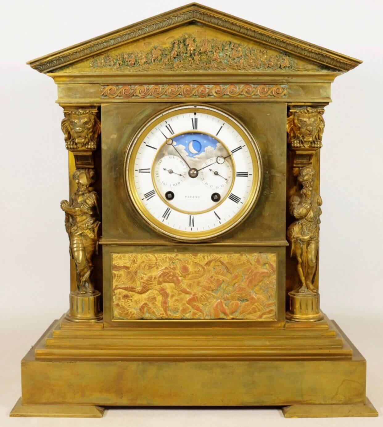 A fine and rare month going neoclassical perpetual calendar clock garniture by the renowned clock-makers, Achilles Brocot and Jean Baptist Delettrez.
Inset with embossed metal friezes, warrior figures with lion mask capitals with a white enamel