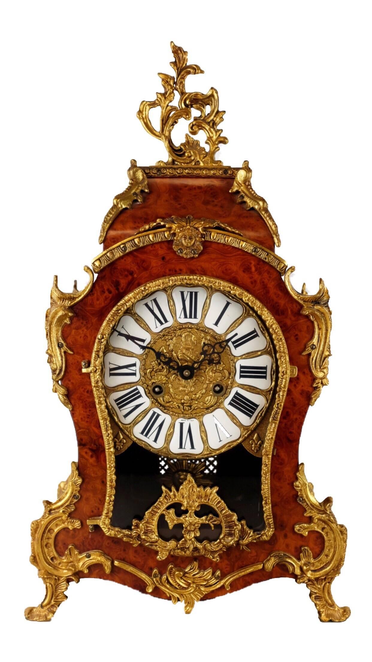 Decorative 20th century walnut veneered bracket clock and pedestal with applied gilt mounts.
The 8 day Ting Tang movement with Sunburst pendulum. strikes the hours and half's on dual bells.
