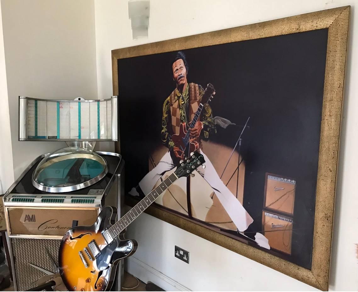 A huge one-off print of Chuck berry on board set within a gilt frame.
This was headed over in person by Chuck Berry at a charity function in Northampton England. 
(See additional image of Chuck on stage in 1973 wearing this costume).