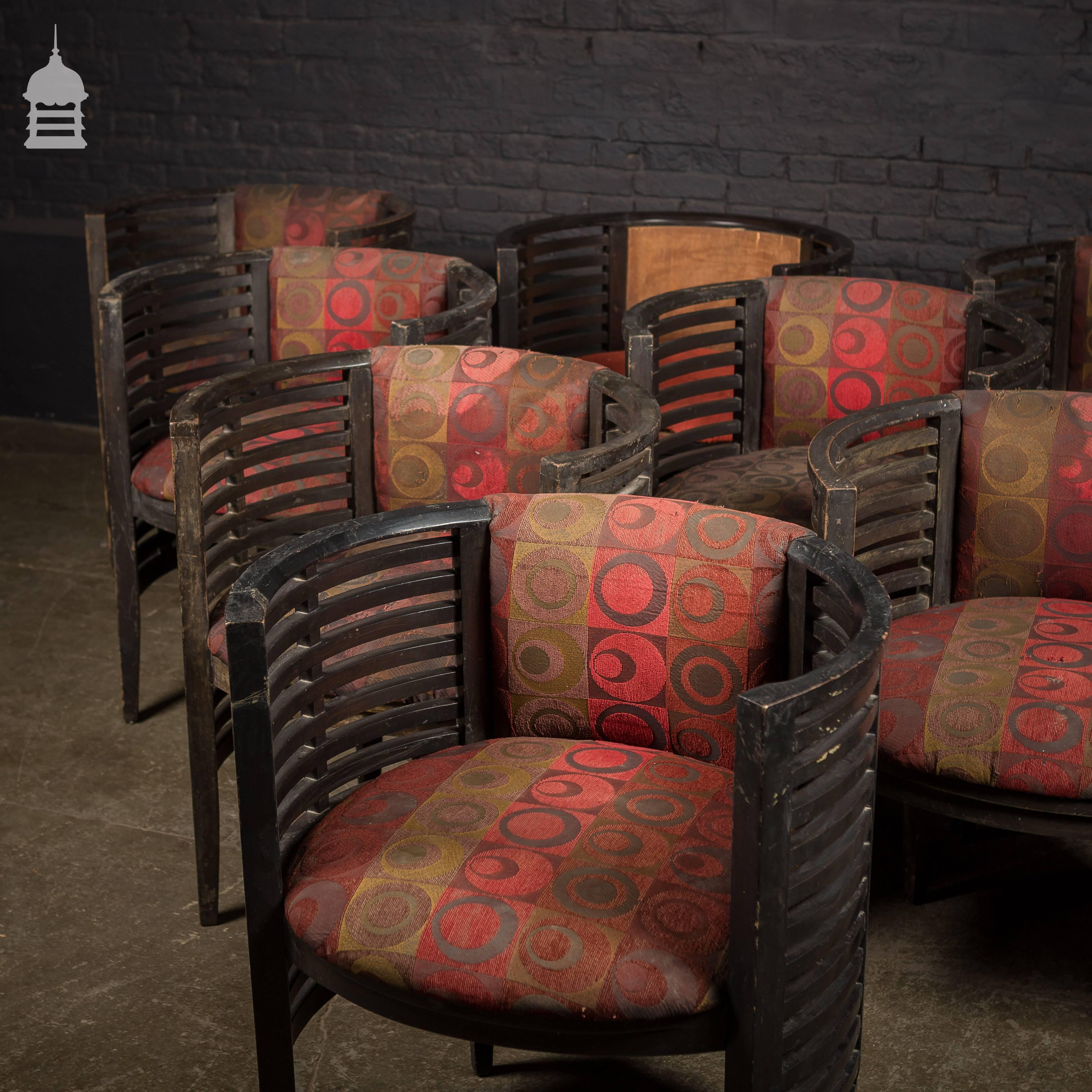 Set of ten Art Deco ebonized tub chairs from a hotel in Bombay.