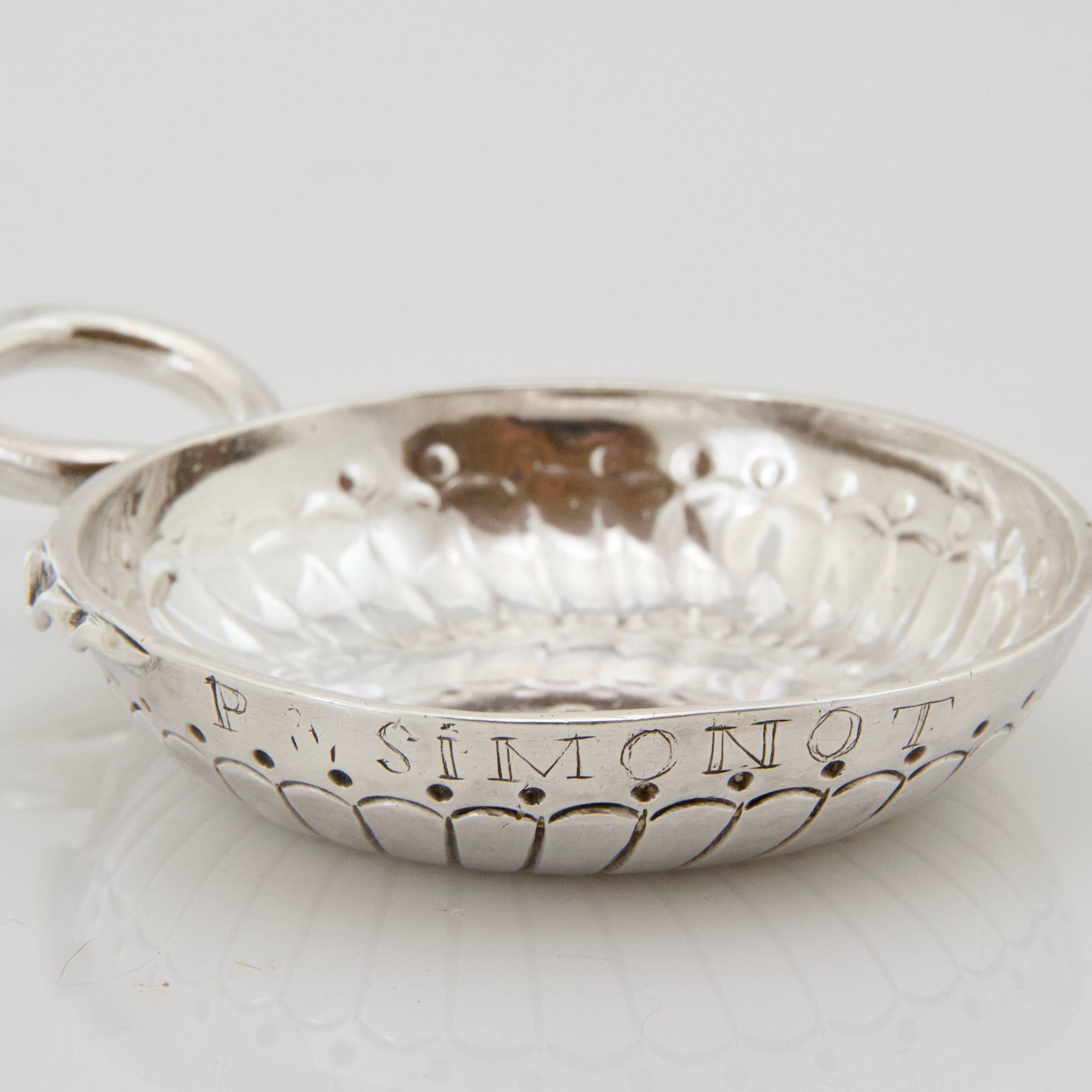 Sterling silver taste-vin, cup present flutes and dots, snake-shaped handle. 
Engraved P.Simonot (owner)
French assay mark and maker's mark on the rim. 
Reference: Nocq. Detail on request. 

 