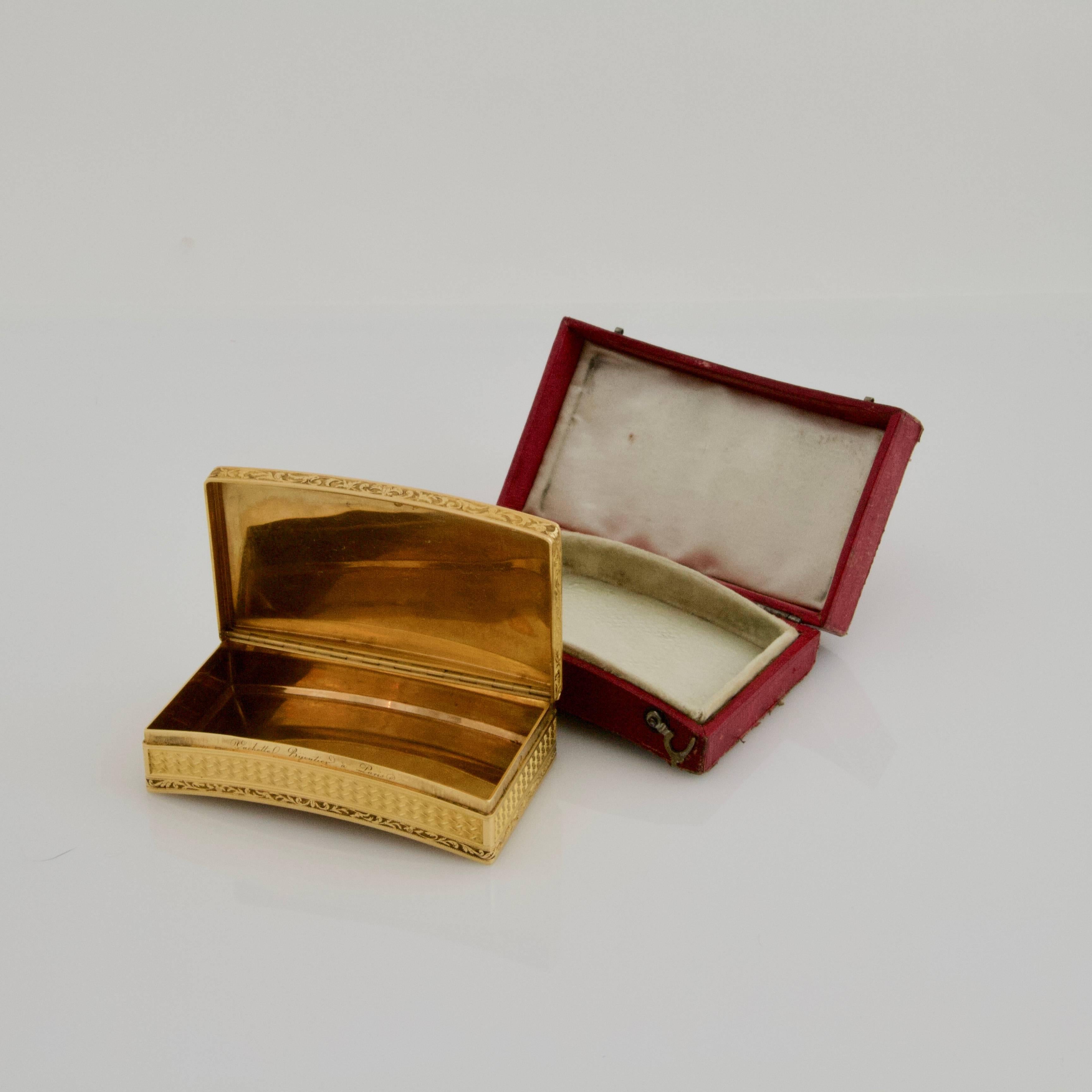 Chased yellow and pink gold hunting snuffbox with a guilloché pattern framed with broad matt borders relieved by a continuous raised burnished scroll and foliage pattern. 
Gently shaped to fit the pocket. 
In its red leather fitted-case. 
One