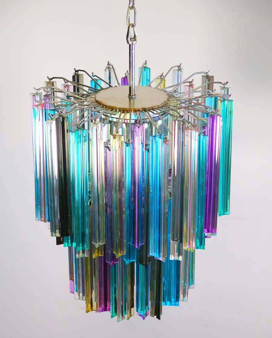 Fantastic pair of Murano chandeliers made by 107 Murano crystal multicolored prism in a nickel metal frame. The glasses are transparent, blue, smoky, purple, green, yellow and pink.
Dimensions: 55.10 inches height (140 cm) with chain, 29.50 inches