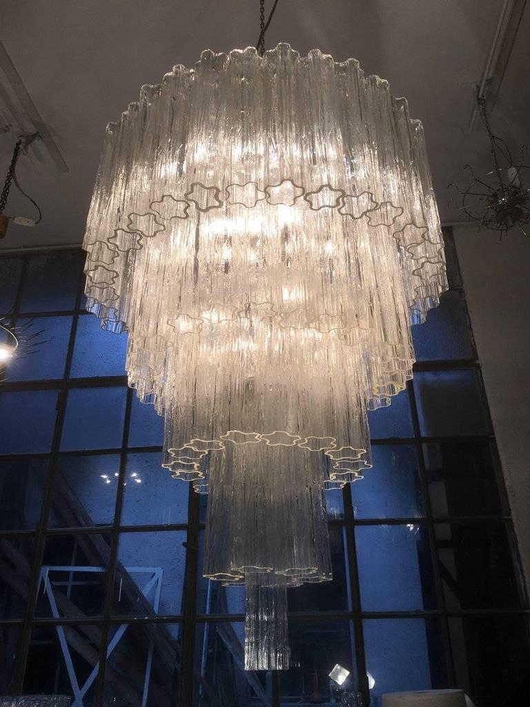 Pair Italian vintage chandelier in Murano glass and nickel plated metal structure on 5 levels. The armor polished nickel supports 78 large amber glass tubes in a star shape.
Period:	Late XX century
Dimensions: 	63 inches (160 cm) height with chain;
