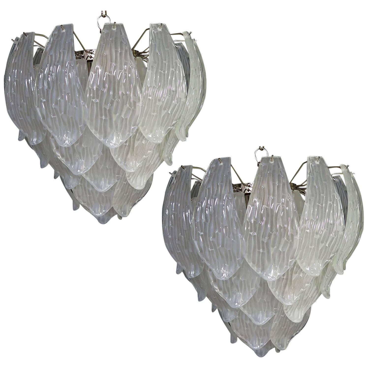 Pair of huge Italian vintage Murano chandelier made by 41 handblown transparent frosted carved glass leaves in a
chrome frame.

Dimensions: 49.20 inches (125 cm) height with chain; 25.80 inches (68 cm) height without chain; 21.25 inches (54 
