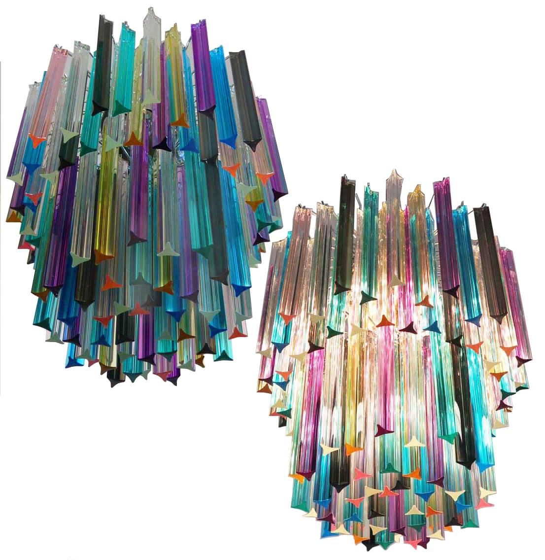 Fantastic Murano chandelier made by 107 Murano crystal multicolored prism in a nickel metal frame. The glasses are transparent, blue, smoky, purple, green, yellow and pink.
Dimensions: 55.10 inches height (140cm) with chain, 29.50 inches height