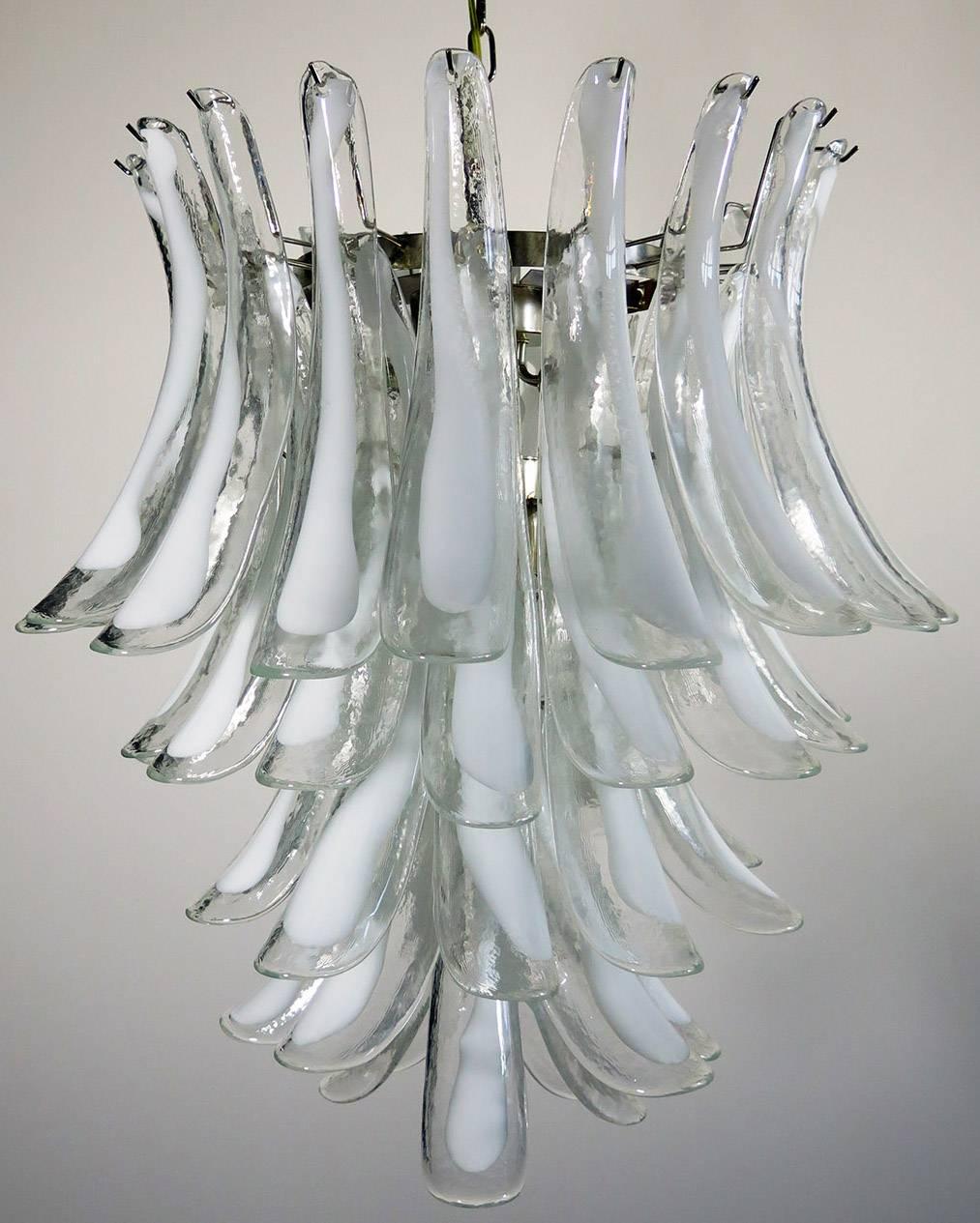 Pair of huge Italian vintage Murano chandeliers made by 52 glass petals (transparent crystal, smooth outside, with crystal powder and then rough inside
Period: 1970s-1980s

Dimensions: 55.10 inches (140 cm) height with chain; 29.50 inches (75 cm)