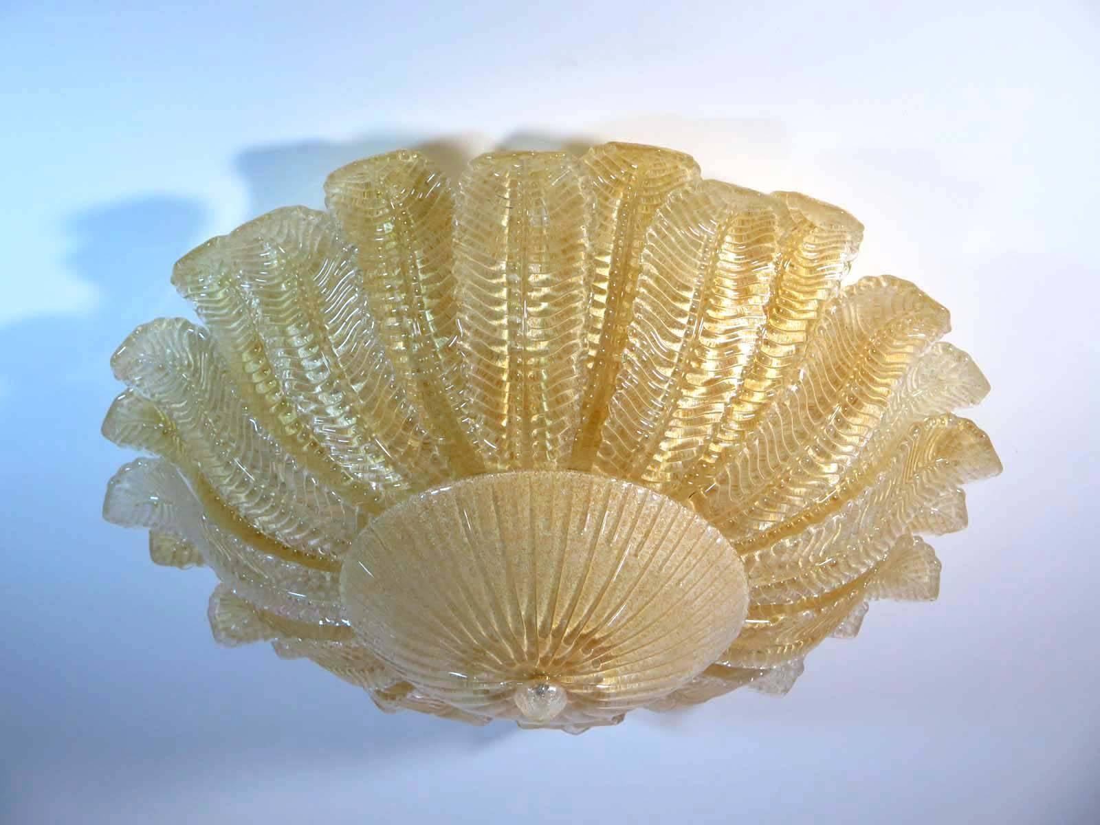 Fantastic and fabulous pair of Barovier and Toso style Murano Italy art glass ceiling lights. The rare lamp is made of 24 mouth-blown hand-formed leaf-form golden powder glass panels plus a huge glass as a bottom. This beauty has the look of a