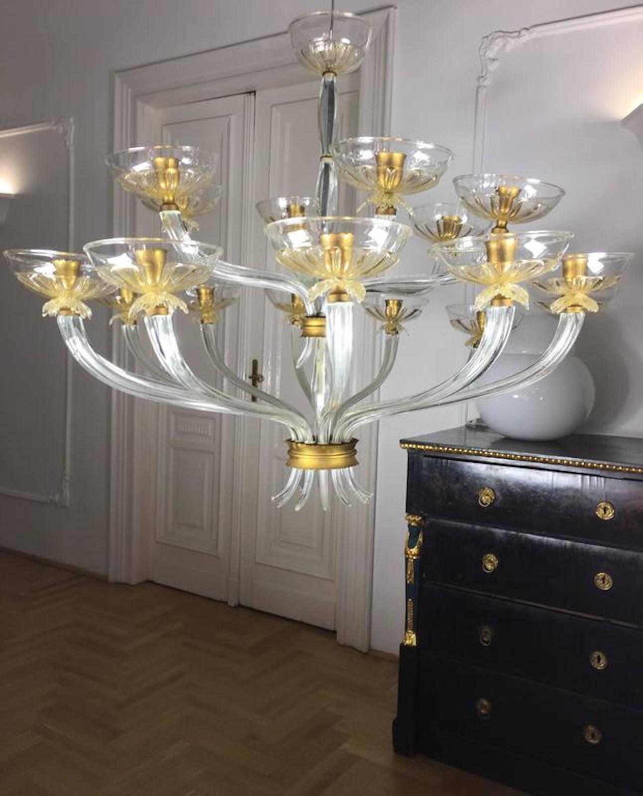 Luxurious chandelier of the renowned Barovier & Toso glassware. It was made with 18 arms, and was refined with elegant gold-plated cups. From the private collection of Baron Von Plant.