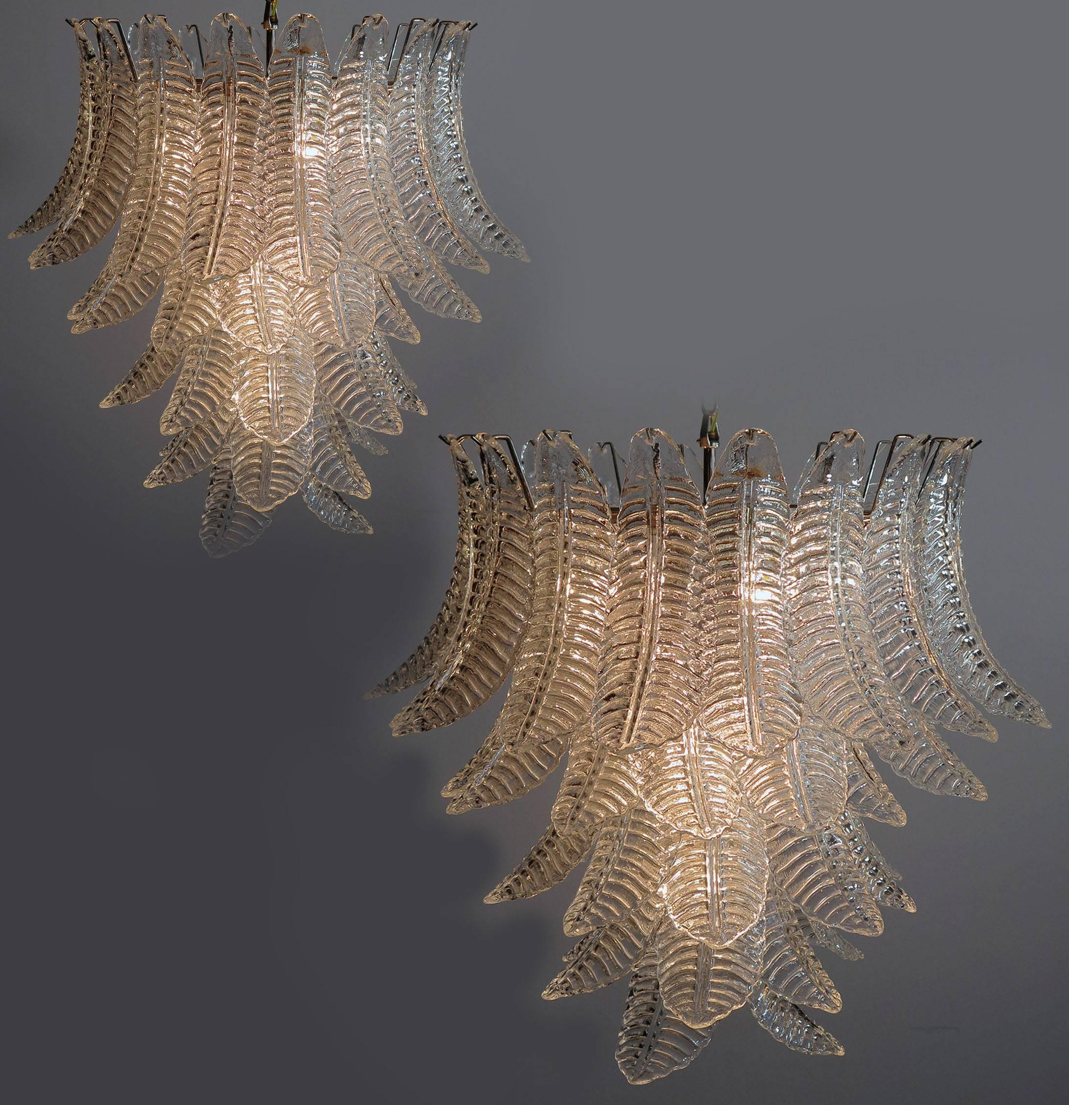 Beautiful and huge Italian Murano chandelier composed of 52 splendid transparent glasses that give a very elegant look. The glasses of this chandelier are real works of art, the weight of this chandelier is 45 kg.

Dimensions: 61 inches (155 cm)