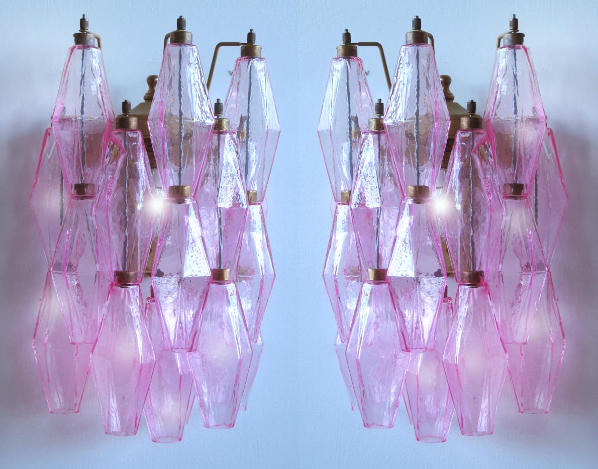 Vintage Murano Italian POLIEDRI pink glass wall sconces
Set six Murano Sconces Glass 100% HAND MADE IN MURANO. The appliques are made by 17 Murano handmade pink POLIEDRI glass, for each one, in a Solid metal frame gold painted and brass.
Period: