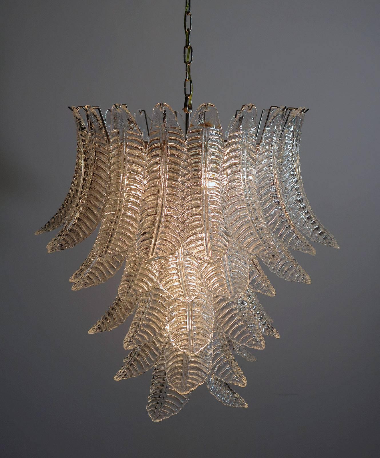 Pair of beautiful and huge Italian Murano chandeliers each composed of 52 splendid transparent glasses that give a very elegant look. The glasses of this chandelier are real works of art; the weight of this chandelier is 45 kg.

Dimensions: 61