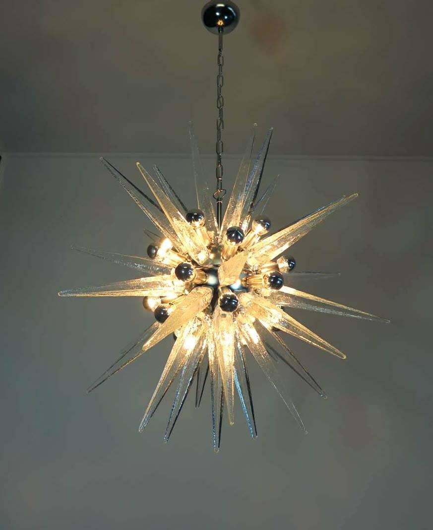 Italian Sputnik chandelier in a nickel frame, clear Murano glass (31 elements). Murano blown glass in a traditional way. 20 light points.
Dimensions: 51.20 inches (130 cm) height with chain; 31.50 inches (80 cm) height without chain; 31.50 inches
