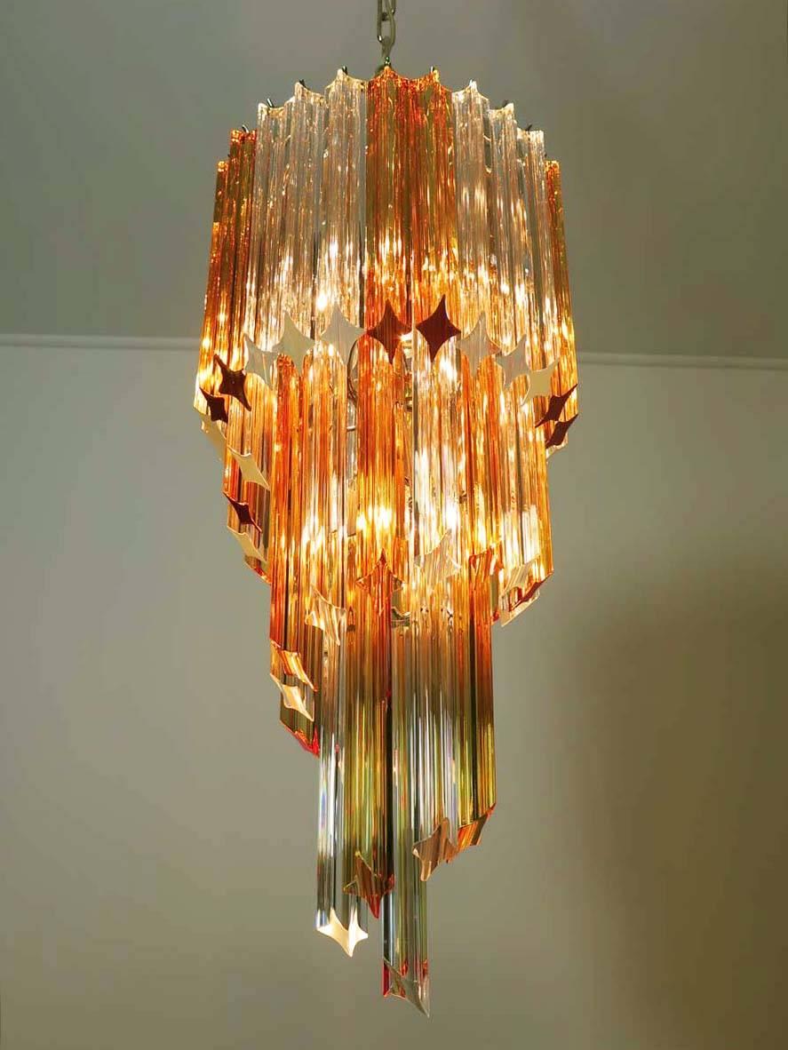 Pair of fantastic and big Murano chandeliers made by 54 Murano crystal prism (quadriedri) in a chrome metal frame. The shape of this chandelier is spiral. The glasses are of two different colors, 24 amber and 30 transparent.

Dimensions: 57.10
