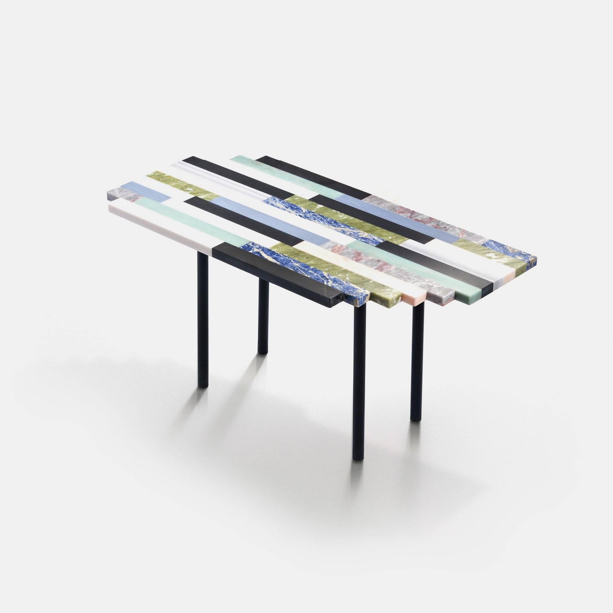 Made of onyx and marble stripes, this coffee table features a geometrical and multicolored inlay pattern. Just like a puzzle, the zigzag edges can interlock with other tables from the same collection, creating compositions with a polychrome parquet