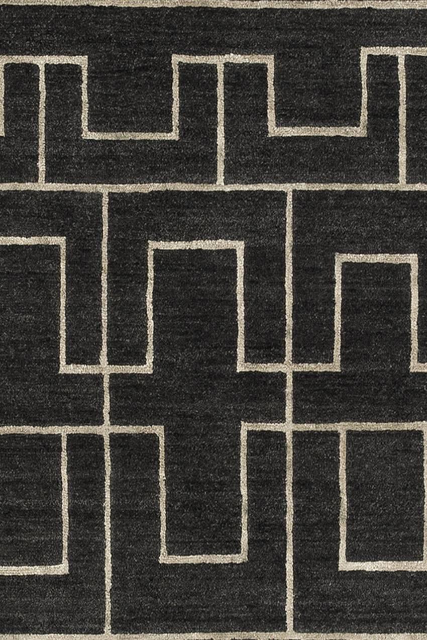 The 'Otane' rug is hand-knotted and made in Tibetan wool, pattern in natural linen.
Low pile (5-6 mm).
Quality: 100 knots by square inch.
Base dark grey, pattern natural linen.
Hand-knotted in Nepal.