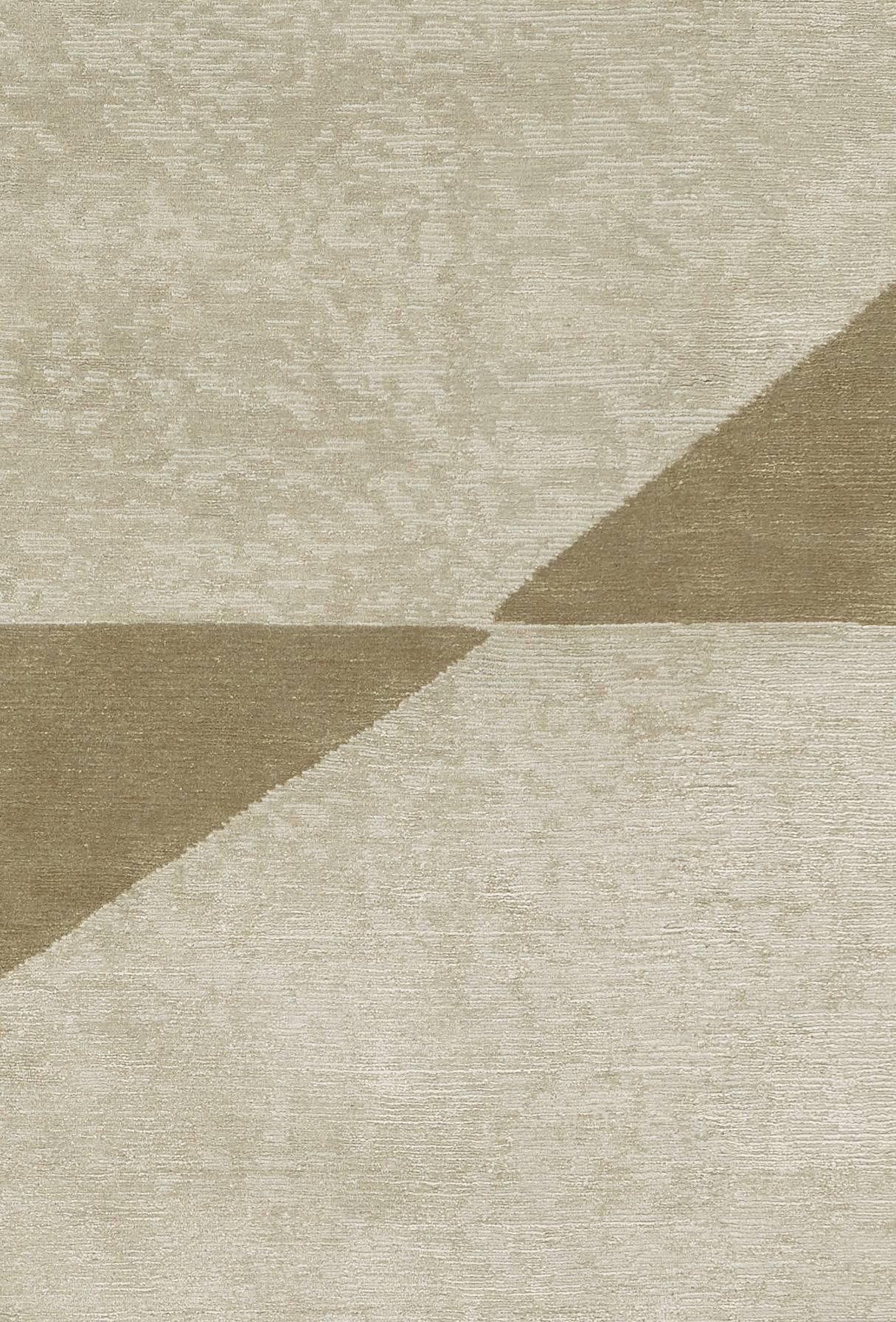Luxurious Komo rug is made of silk and wool (65-35%) and it has a varying loop and cut texture.
The colors are light grey and brass (greenish-beige).
Low pile (5-6 mm). Quality: 100 knots by square inch.
Hand-knotted in Nepal.

 