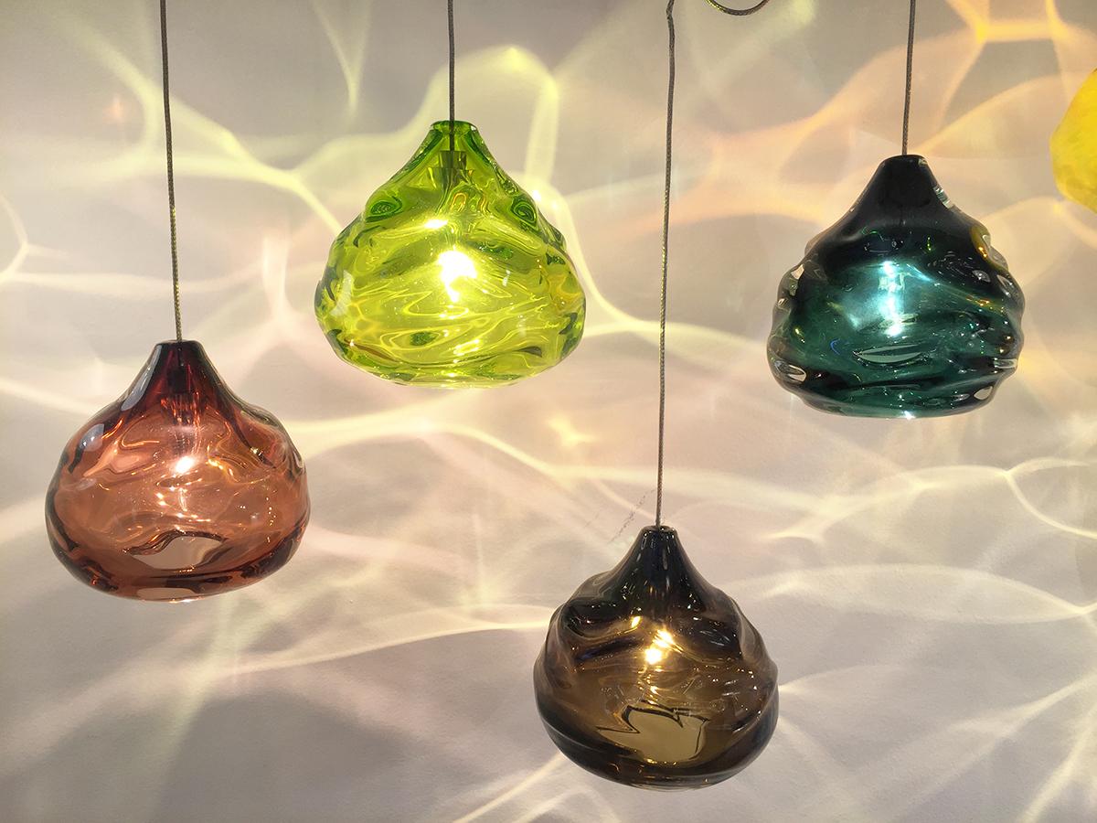 Small lime green happy pendant light, hand blown glass by Siemon & Salazar, canopy included
Glass measures 4.5”T x 4.5”W

These works play with the reflective and malleable qualities of glass. This line consists of heavy thick-walled pieces, which