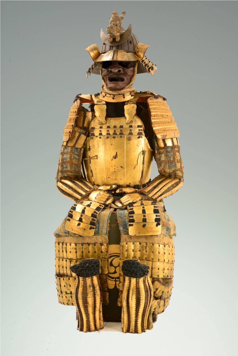 Eighteenth century iron samurai battle harness in the style of Date Masumune, lord daimyō of Sendai Province, lacquered gold.  Masamune's followers adopted the heavy, war-like Sendai style breastplate popularize by their master.  The heavy iron