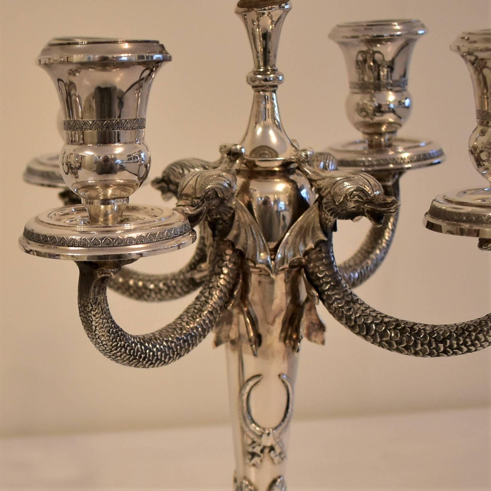 A pair of matching 20th century solid silver five branch candlesticks / candelabras featuring artistic fish and scales designs. Makes for a stunning ornate table ornament. Weight: 2105grs and 2122grs each. Heavy cast using the traditional