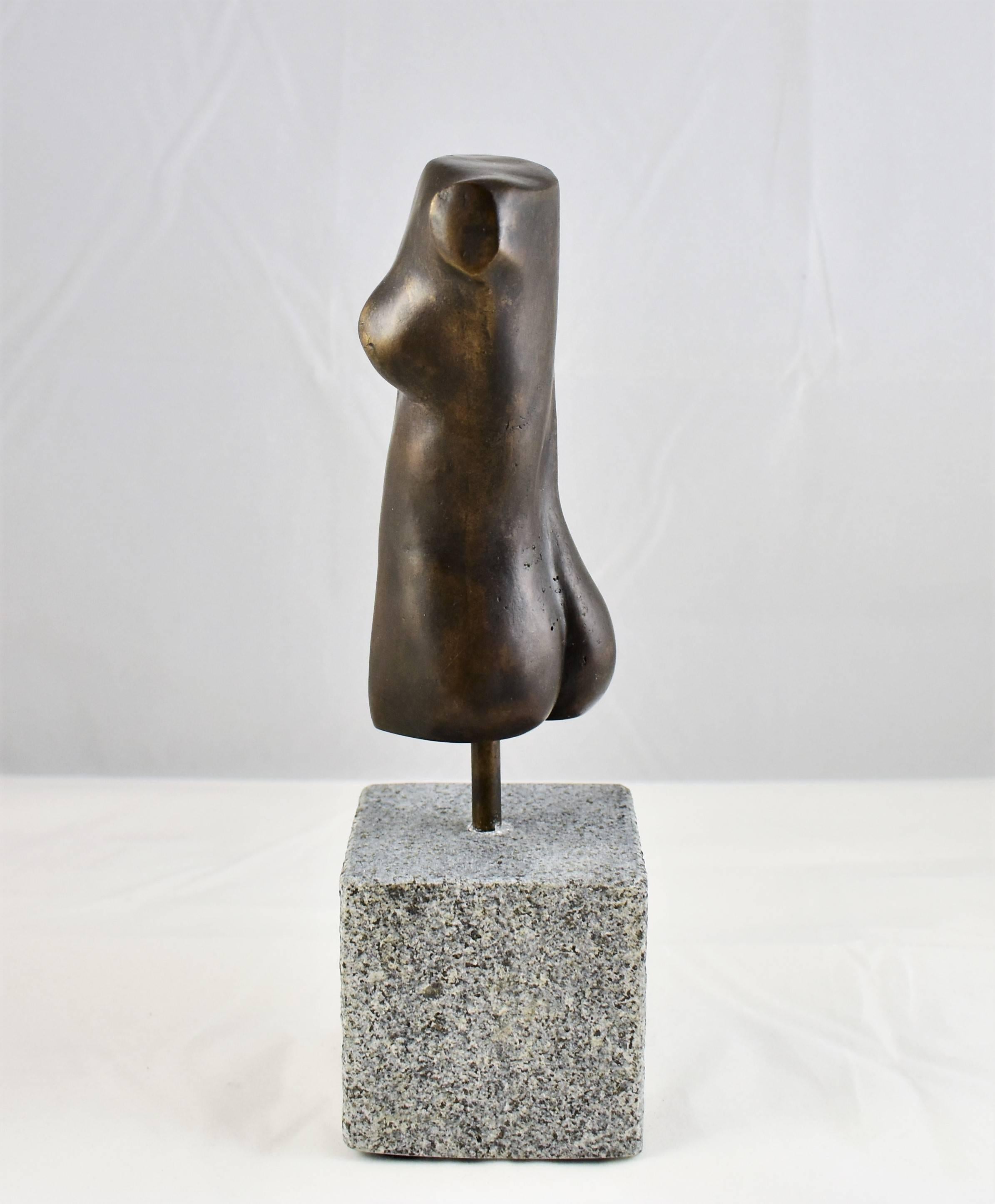 A modern bronze sculpture of a female form/torso with a black patina finish. Hand made by the artist then hand cast. Modernistic and artistic design capturing the essence of the female form with graceful lines, beautiful from every angle. Mounted on