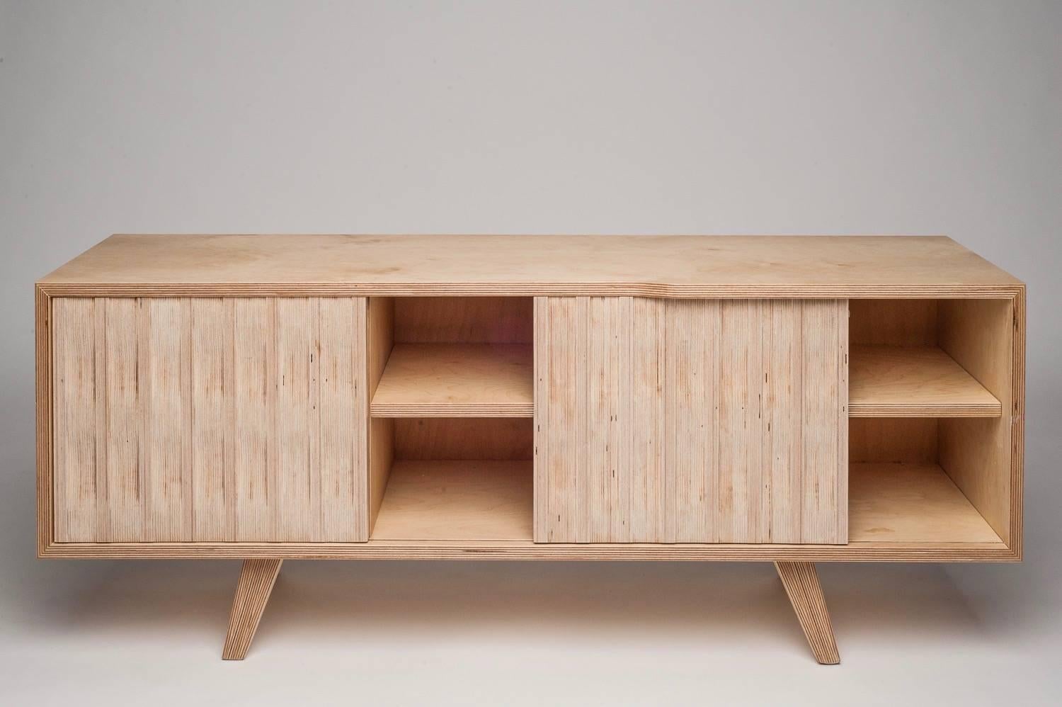 The Mabley sideboard featuring individually hand shaped end grain doors, giving it a unique textured look and feel. Seen here in natural birch, it features three shelved sections with two sliding doors.
This item is made to order meaning sizes and