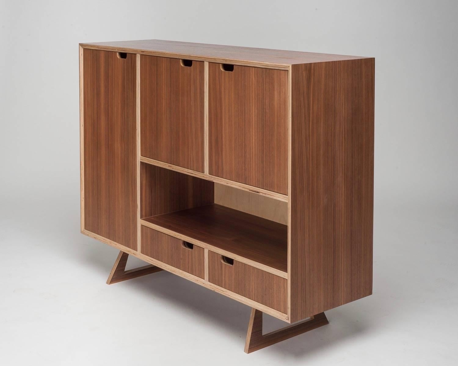 The Bercil sideboard seen here in American walnut. Reduced in price, this piece is a fully functioning prototype showroom piece with very minor wear.
