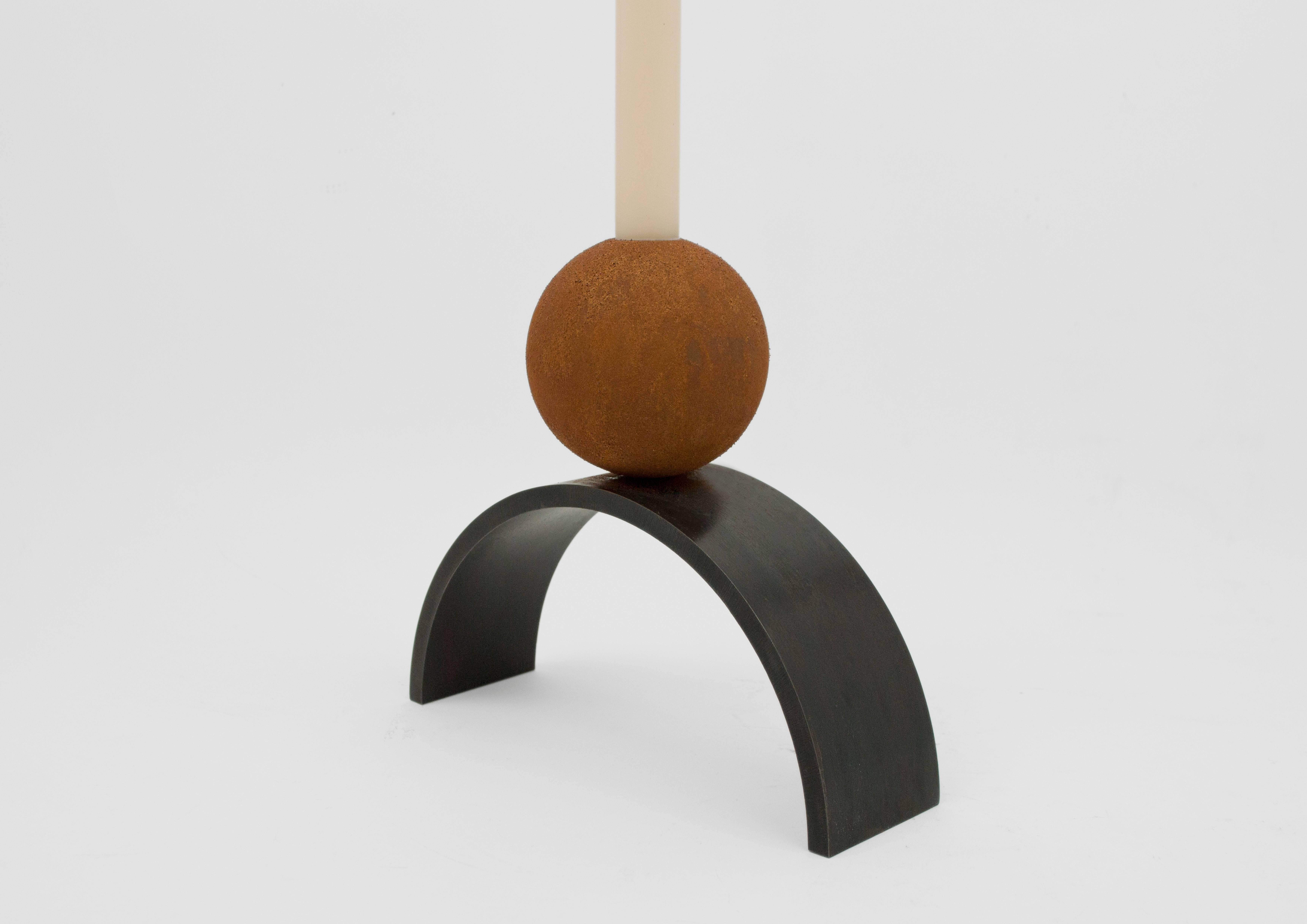 Louis Jobst' arch and ball extra large candleholders are little monuments to have in the home. The form derives from paintings by Jobst of monumental shapes and forms.

Each candle stick holder is handmade from mild steel and patinated black. The
