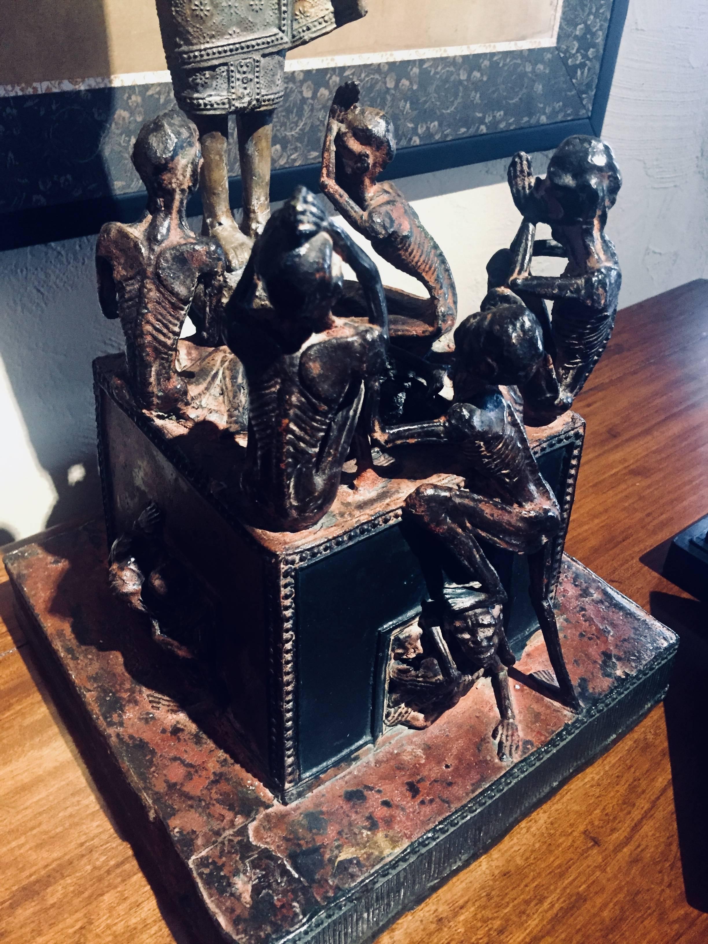 An intriguing bronze sculpture. A Buddhist Monk, Phra Malai is depicted in his journey to hell.

The legend of Phra Malai, a Buddhist monk of the Theravada tradition said to have attained supernatural powers through his accumulated merit and