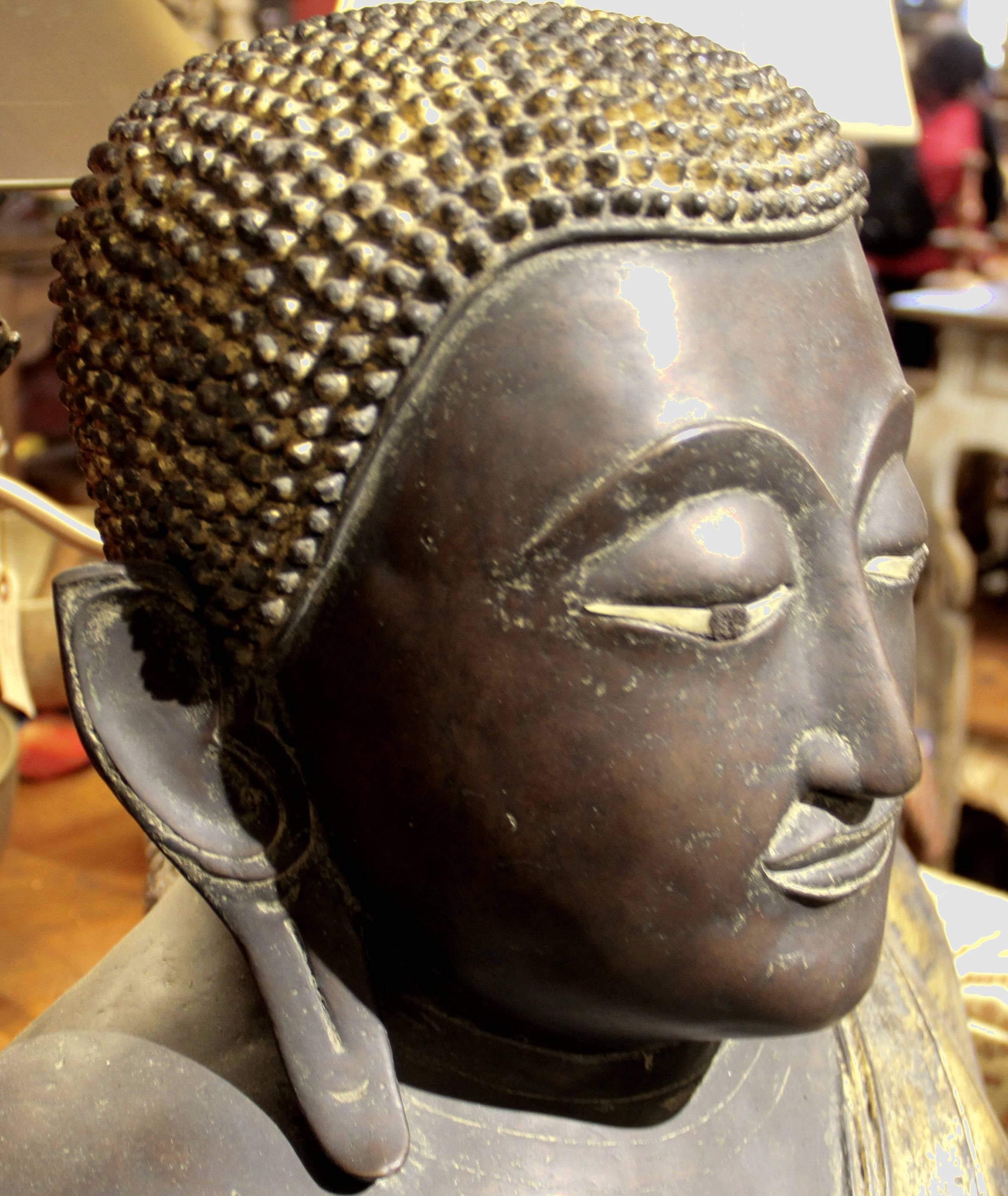 This prominent Buddha is from Thailand, 19th century.
Measures: 32 H x 32.5 x 12 D
It comes from the Rattanakosin Kingdom, which is the fourth and present traditional centre of power in the history of Thailand (or Siam). It was founded in 1782