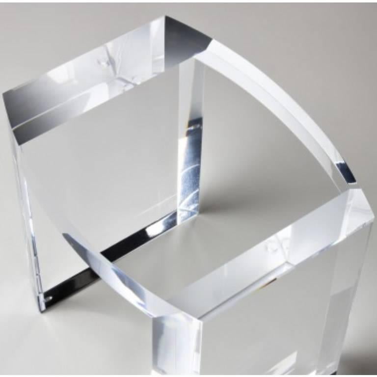 This solid Italian acrylic side table has a unique tear drop shape and elegant thick legs that make them a perfect addition to any type of design. Contemporary or modern, but also paired with traditional or Asian furniture. 
Measures: 20 W, 16 D,