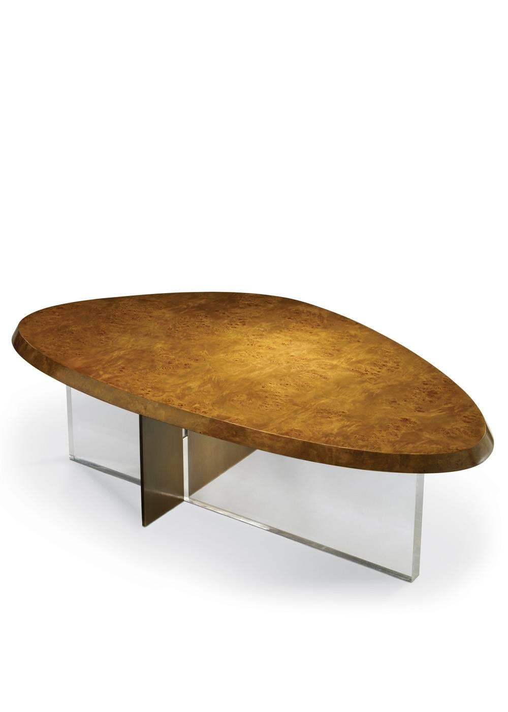 A beautifully crafted coffee table in a contemporary modern design made from mappa burl medium tone wood veneered top raised on a bronze patinated metal plate joined with a 1 1/2