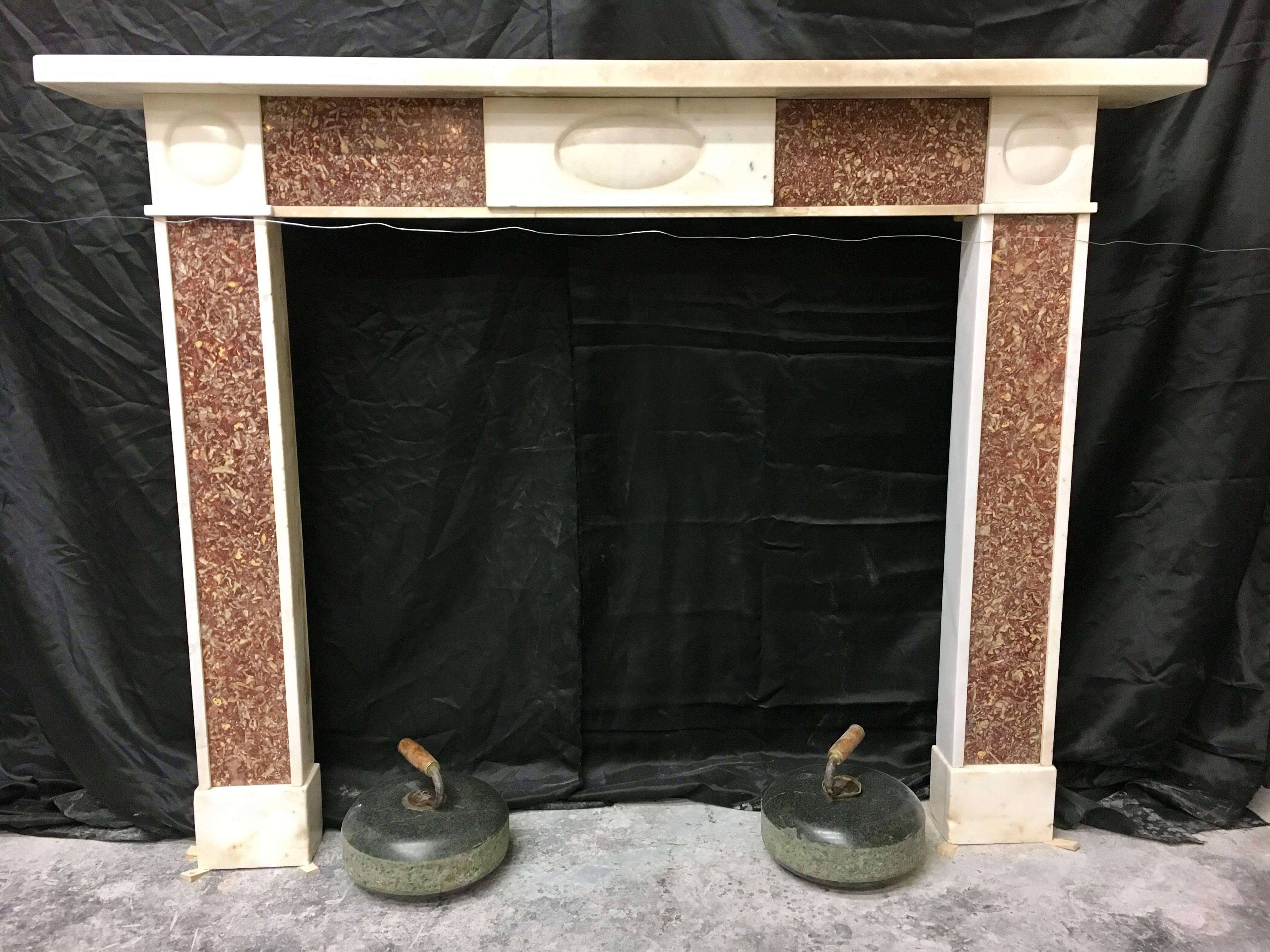 A large and unique Edinburgh New Town Georgian bullseye fireplace in statuary marble with Greek Semesanto panels, an oval recessed central tablet gives this piece balance and elegance.
Fire opening: 1030mm high x 1060mm wide