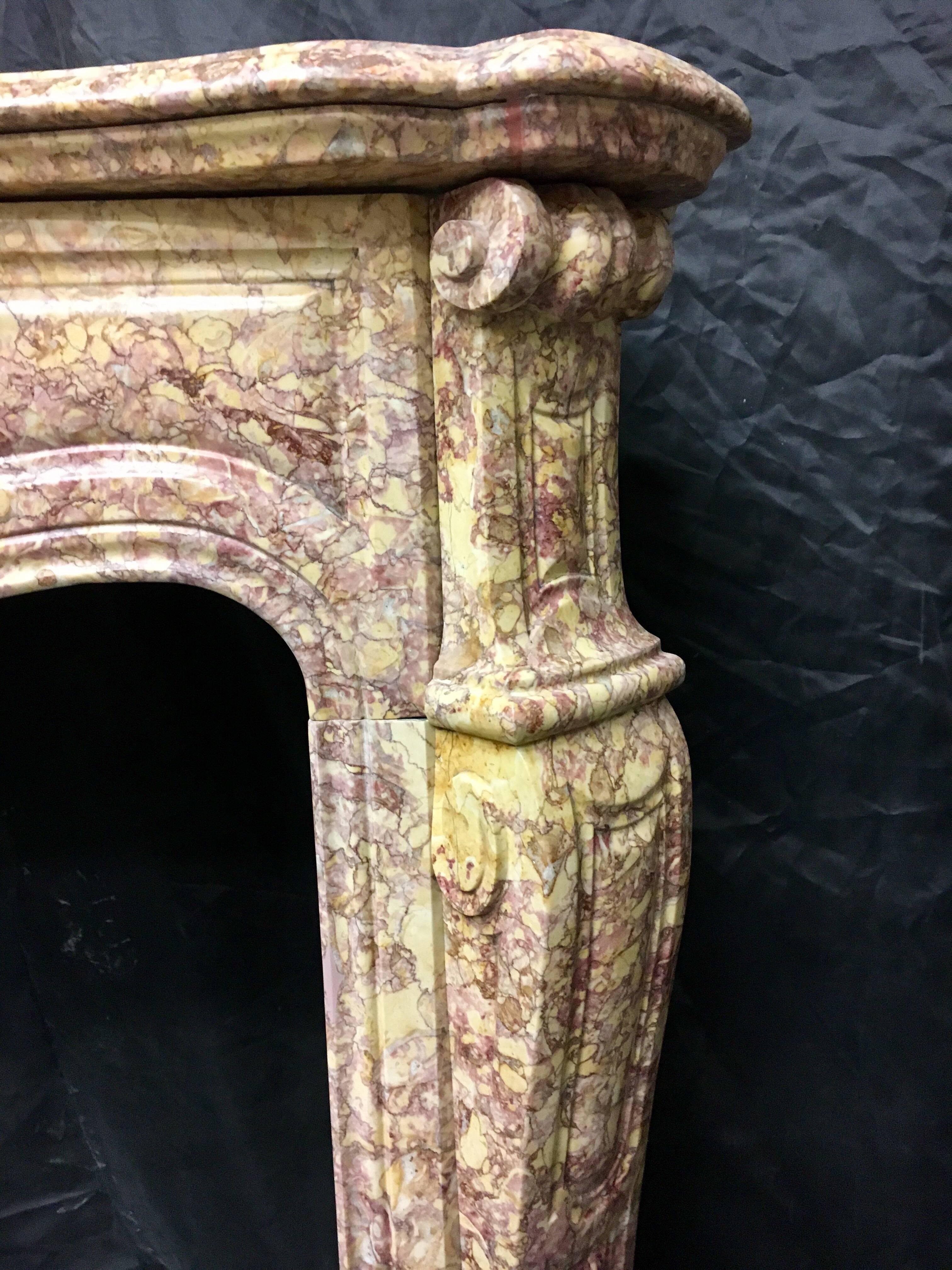 A rare and very pleasing antique Louis XVI Brocatelle marble fireplace surround, now fully restored and polished- ready for installation.