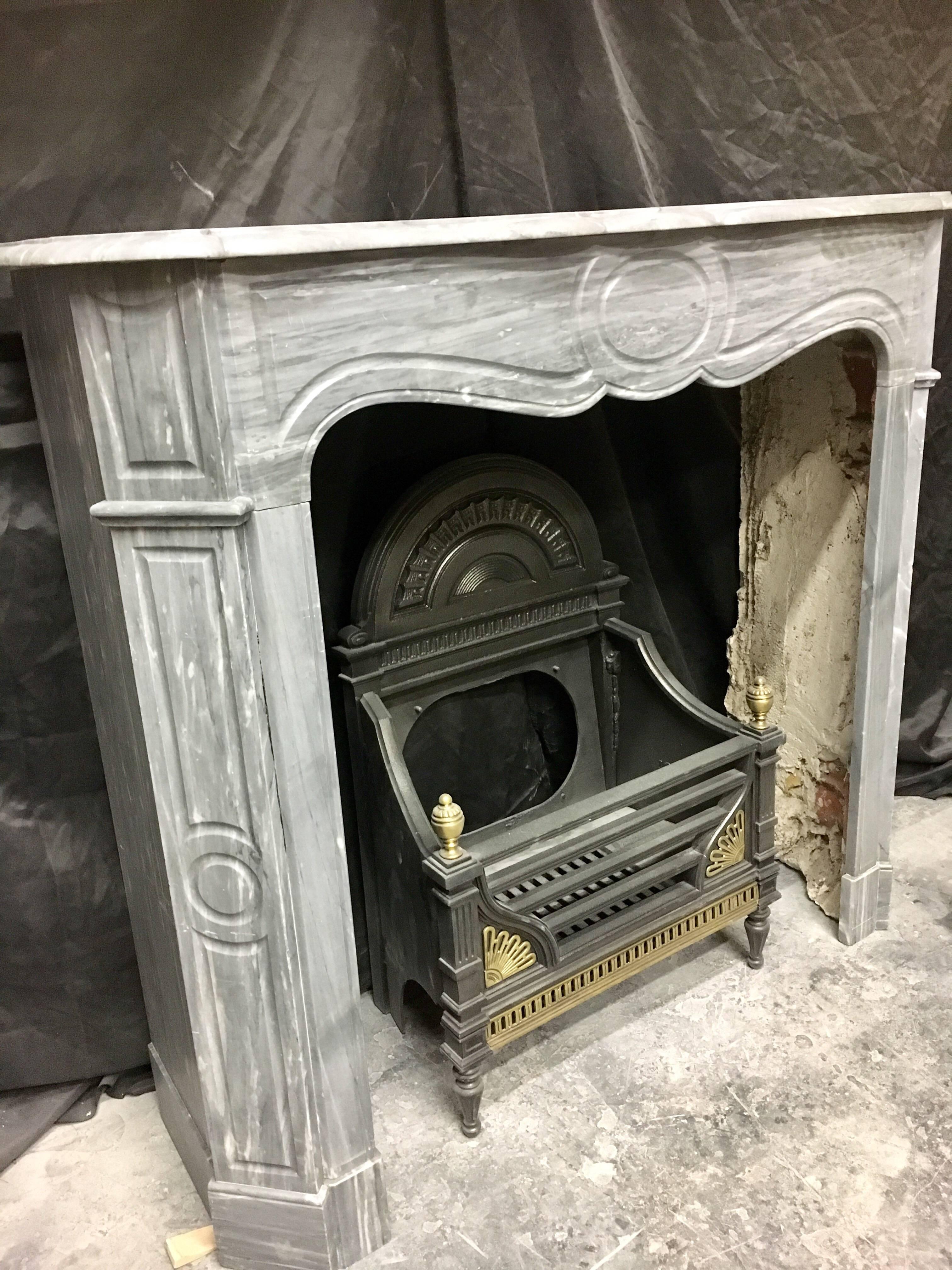 An elegant and simple Antique French Louis XVI Pompadour Style Fireplace surround in Blue Turquin Marble, fully restored and polished, will suit a smaller room, either period or contemporary.

French late 19th Century.

Fire opening size: 880mm high