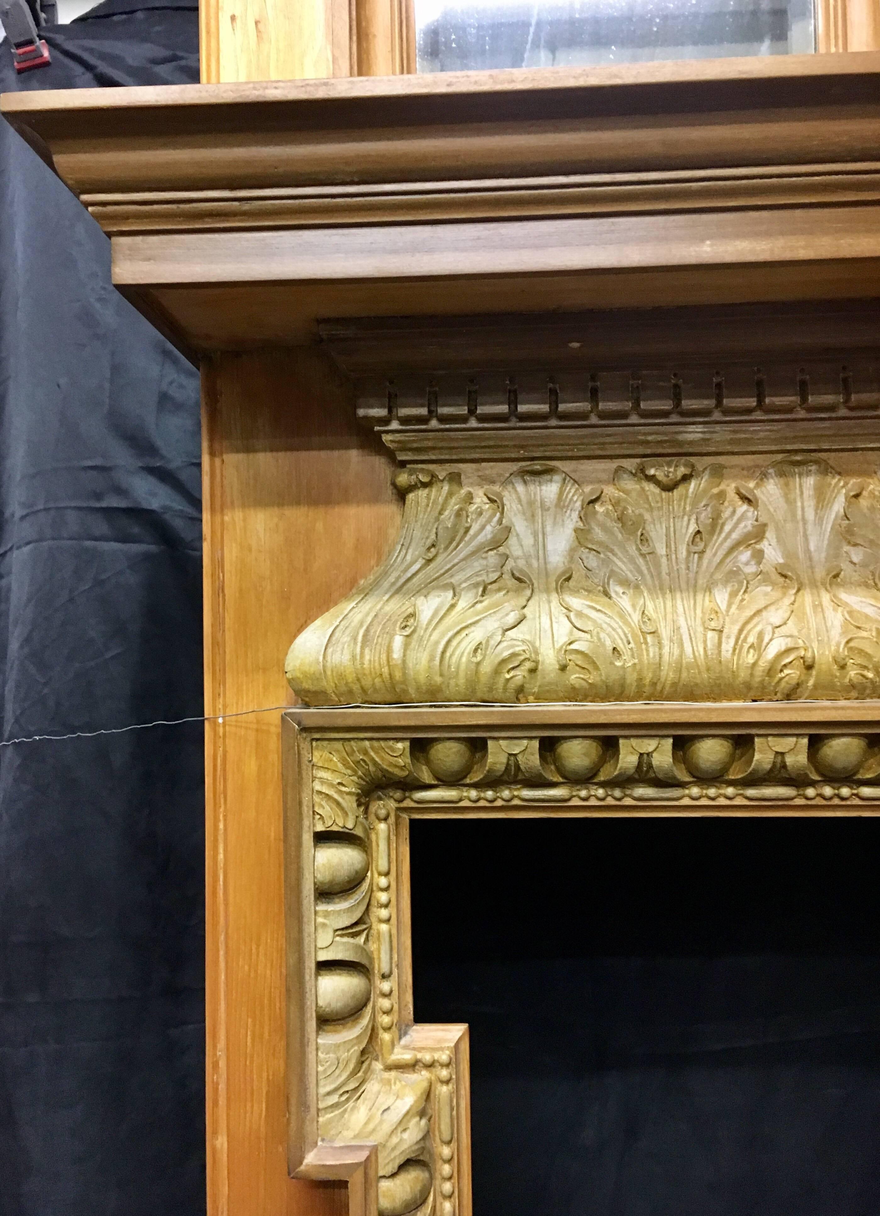 A large and attractive late 19th century Pine & Gesso fireplace surround complete with its original over mantel mirror. The triple bevelled mirror sits within separate frames featuring acanthus leaf decoration running along the top of the pediment,
