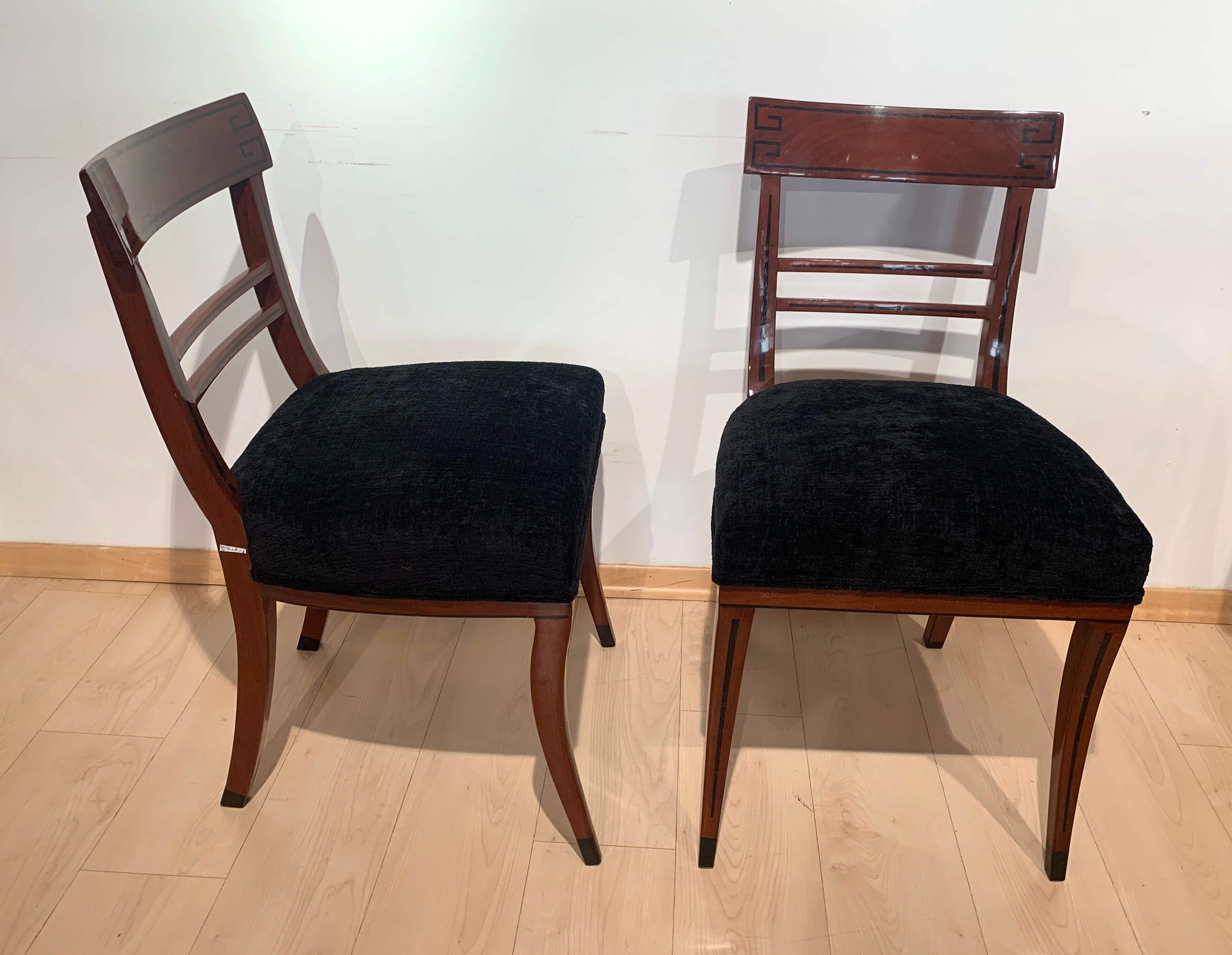 Beautiful neoclassical / early Biedermeier side chairs from Vienna, Austria, circa 1820.
Mahogany solid wood with ebony inlays. Hand polished with shellac (french polished.
Newly upholstered with black structured velvet and double keder.
 
2