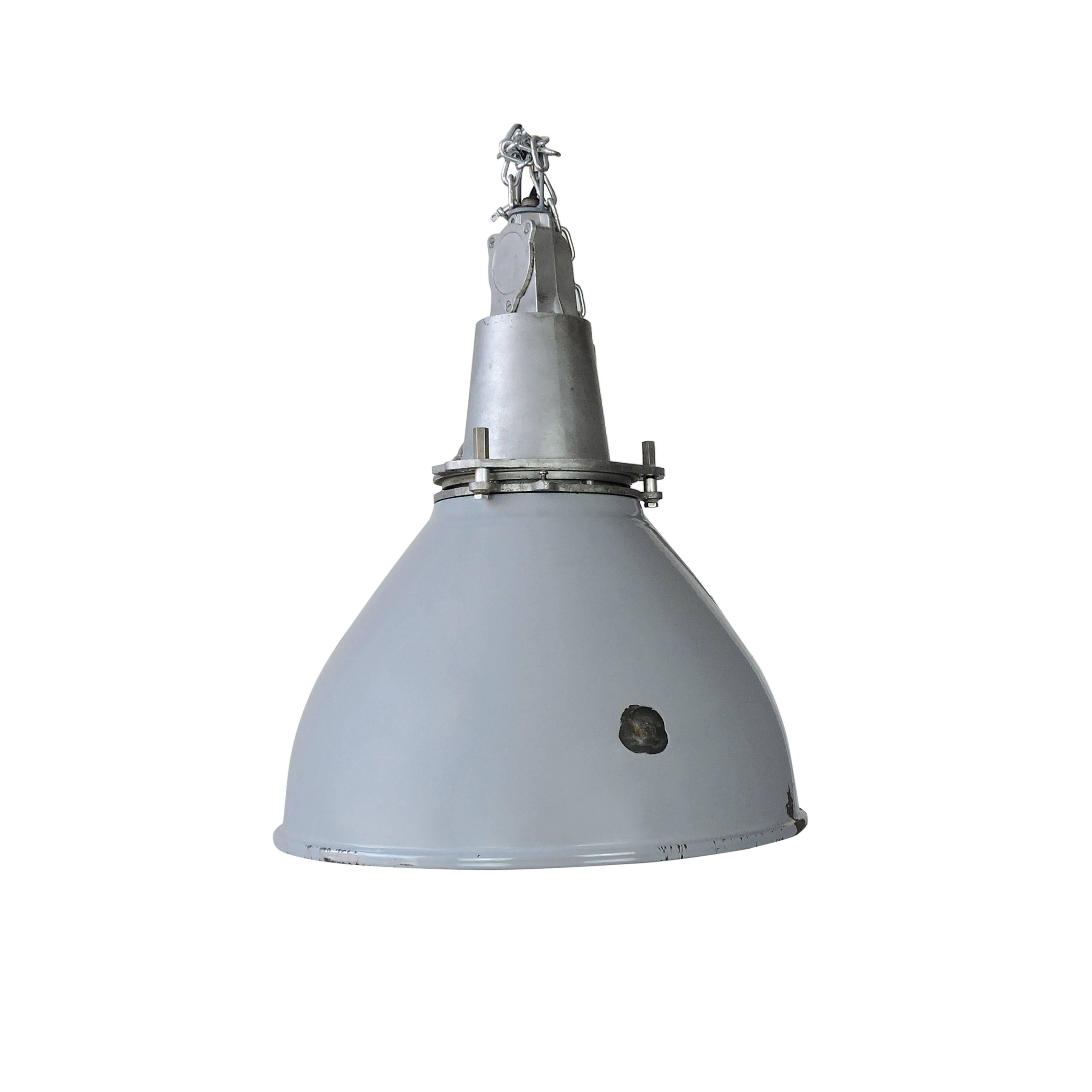 A Classic British vintage Industrial lamp with grey enamel featuring a white interior.