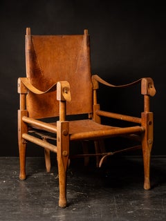 Two vintage Danish Safari chair in tan leather by Kaare Klint for Rud Rasmussen.