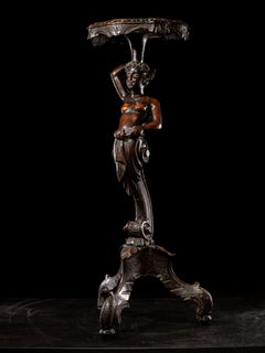 Anthropomorphic walnut satyr-form pedestal on tripartite scroll feet bases.