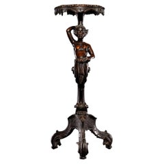 Anthropomorphic walnut satyr-form pedestal on tripartite scroll feet bases.