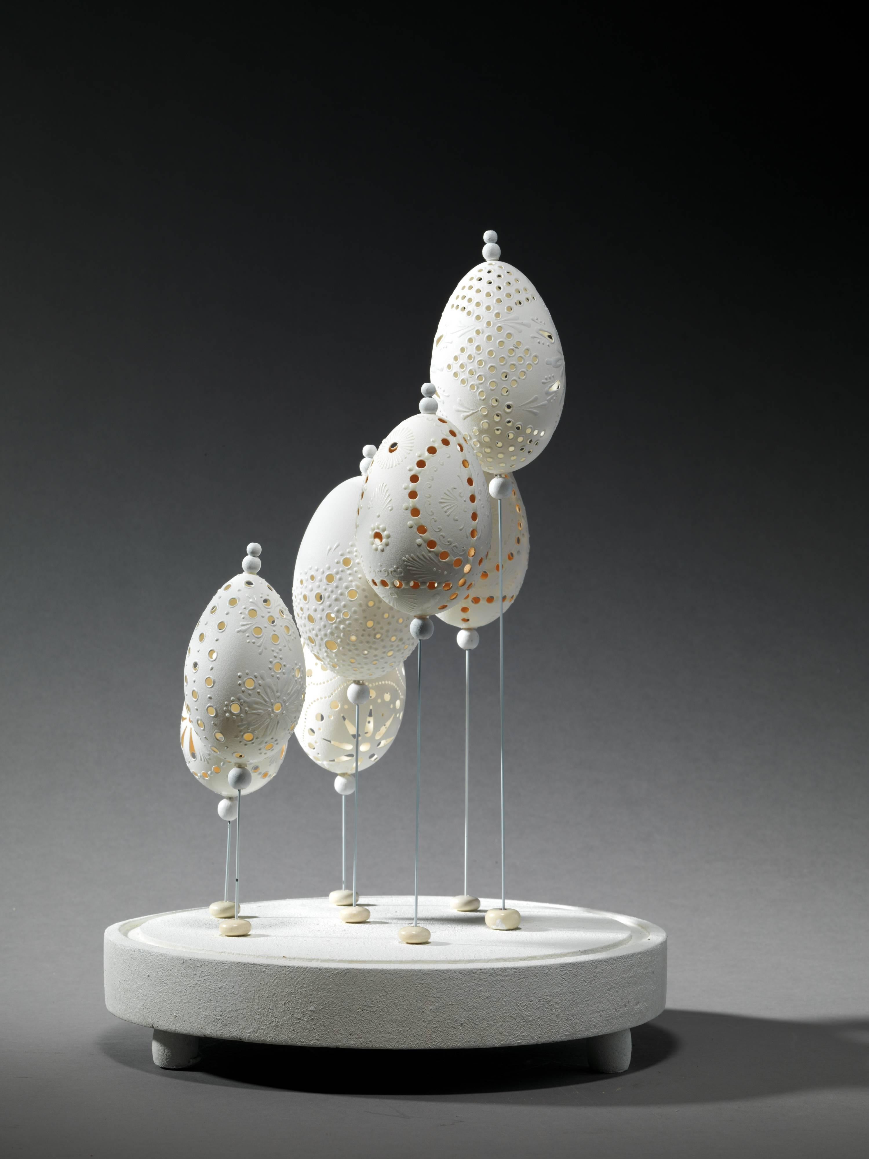 Five Goose eggs decorated with different design incisions.