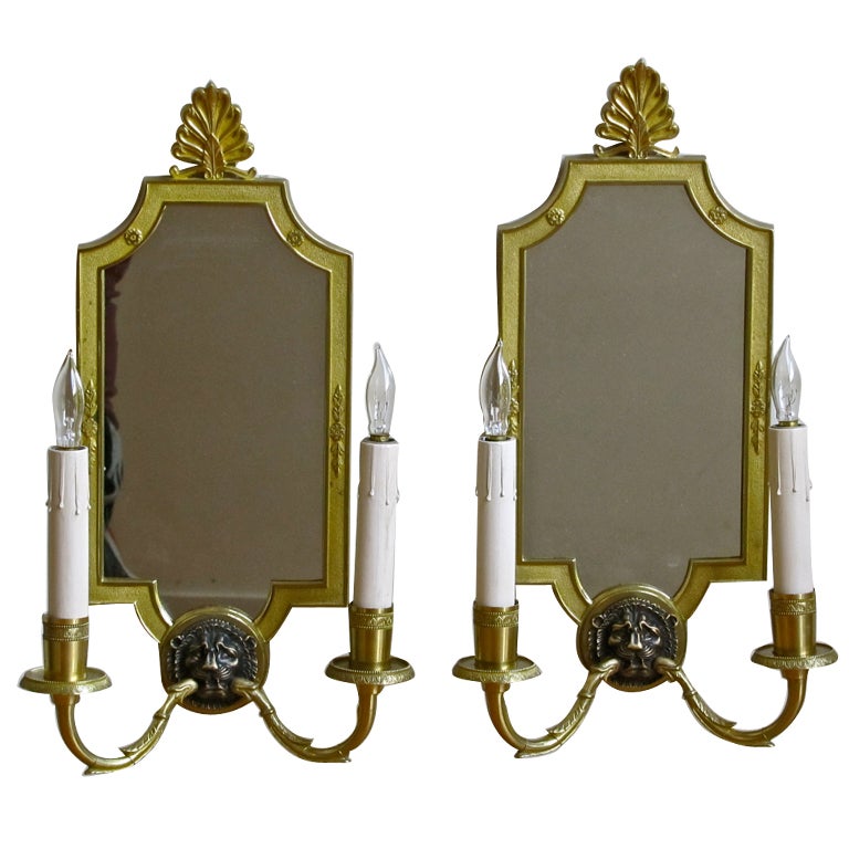 Pair of Mirrored Brass French Empire Style Lion Sconces For Sale