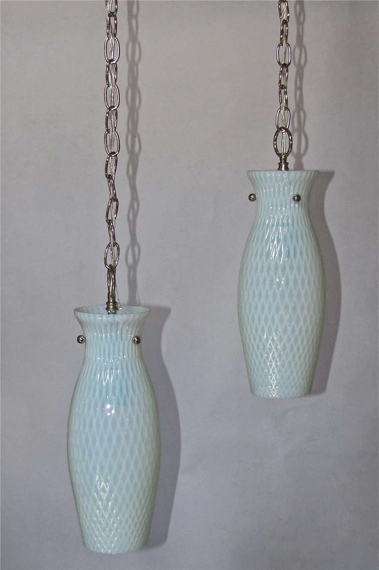 Pair of handblown Italian glass opalescent pendant lights with nickel-plated fittings. Glass bodies have a lattice or honeycomb pattern. Newly wired for US, each fixture uses a single A or Edison base bulb. Would be beautiful over a kitchen island