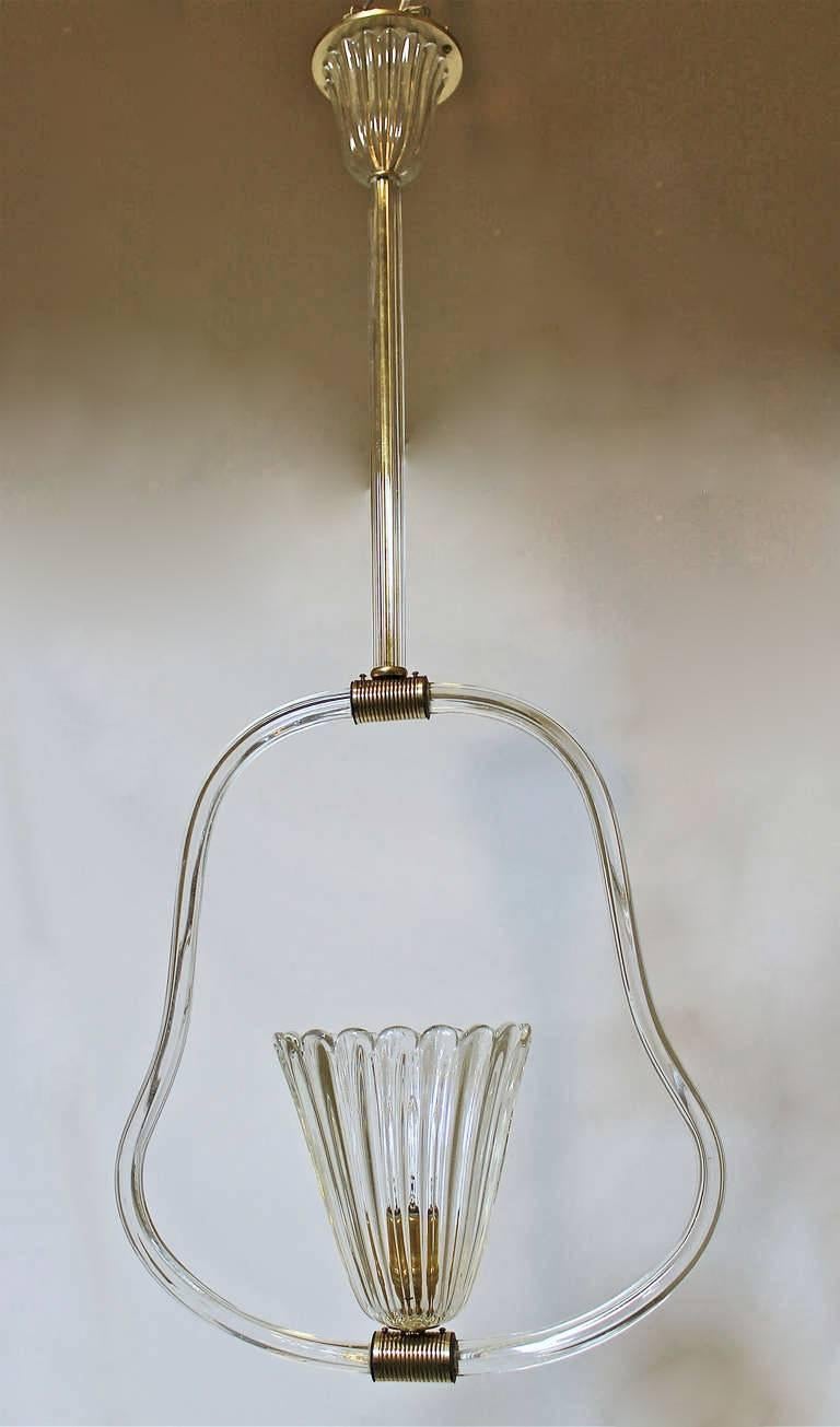 Barovier & Toso pendant light or chandelier crafted from clear ribbed glass accented by reeded brass fittings. Rewired for the US, fixture uses 1 - 60 watt recommended max A or Edison base bulb. 

Measures: 36