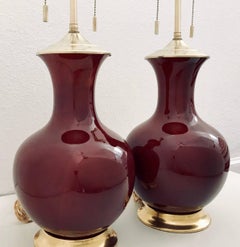 Pair of Sang de Boeuf Oxblood Ceramic Lamps on 23-Karat Water Gilt Bases