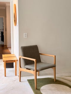 Modern and minimalist “Oscar” armchair, made of solid wood upholstered in fabric